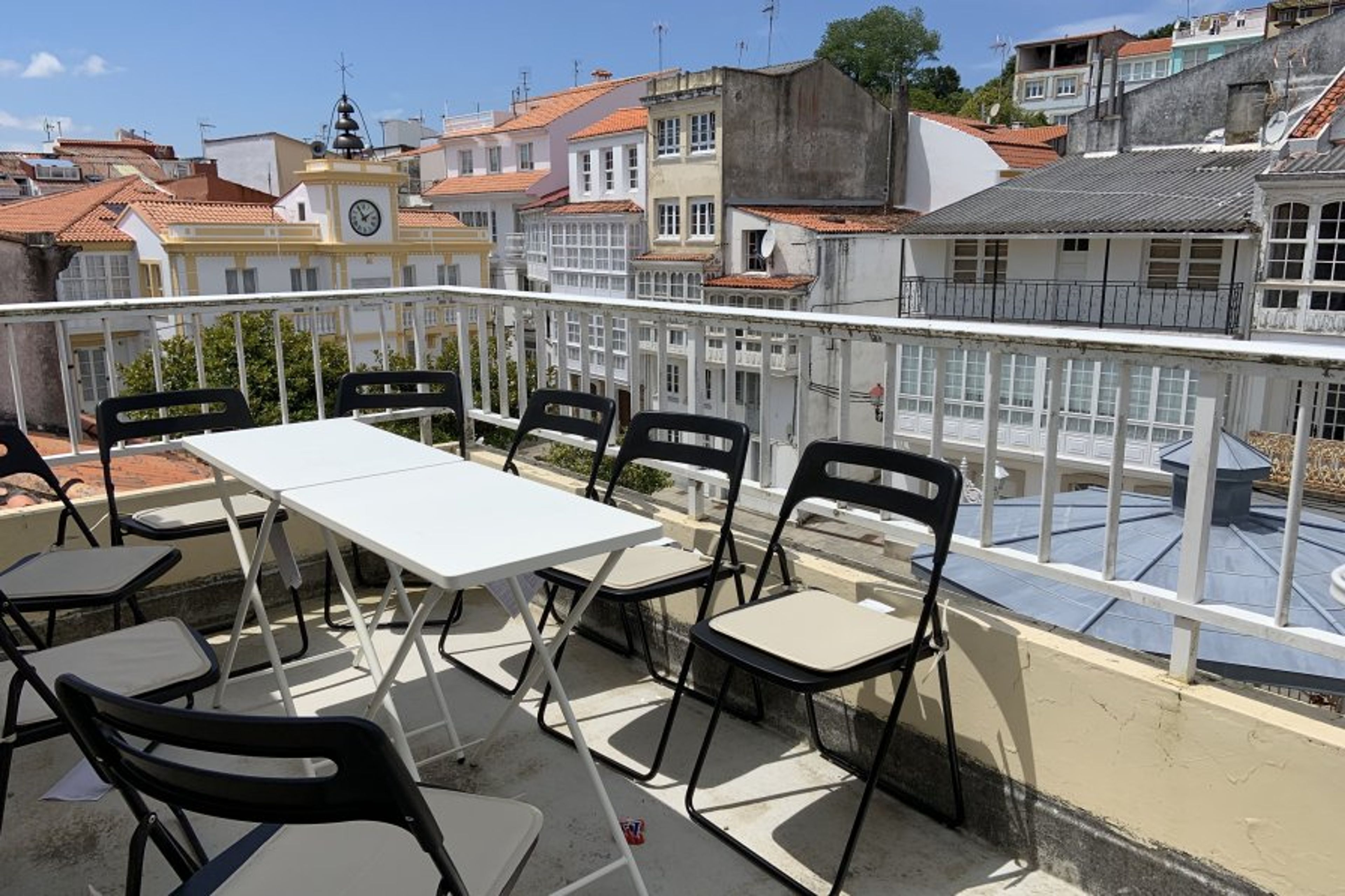 small sunny roof terrace, with views over the square