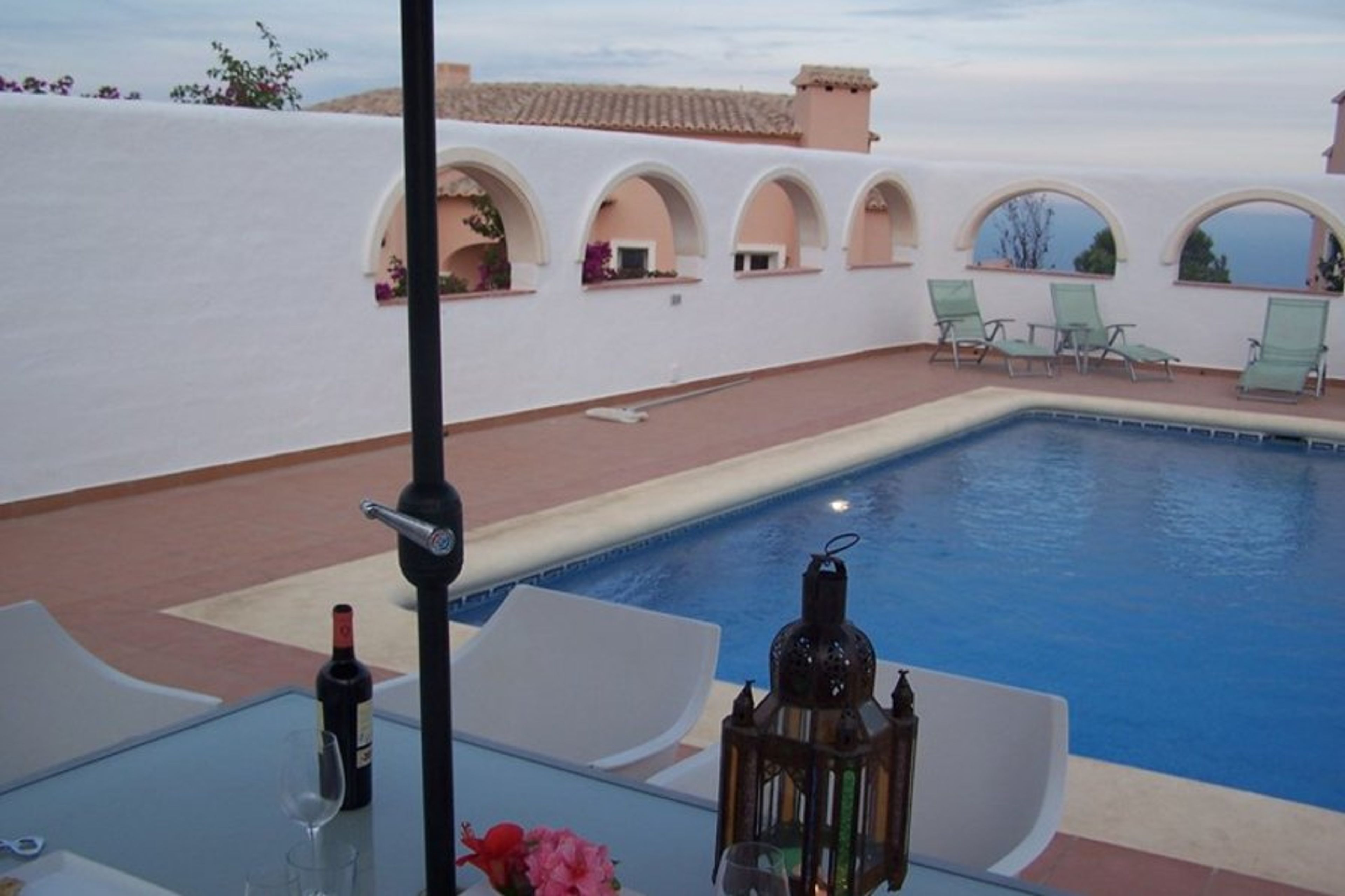 Private pool with arched courtyard overlooking the sea