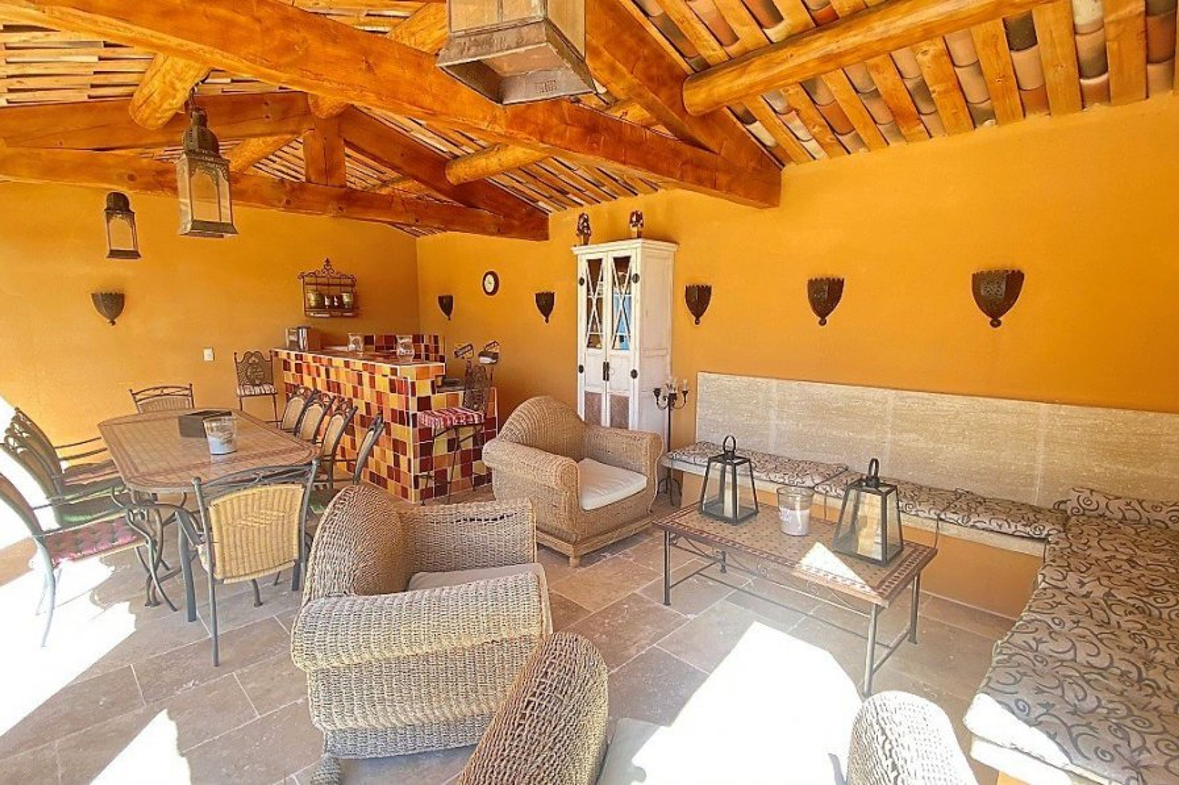 Lovely summer kitchen with outdoor furniture.