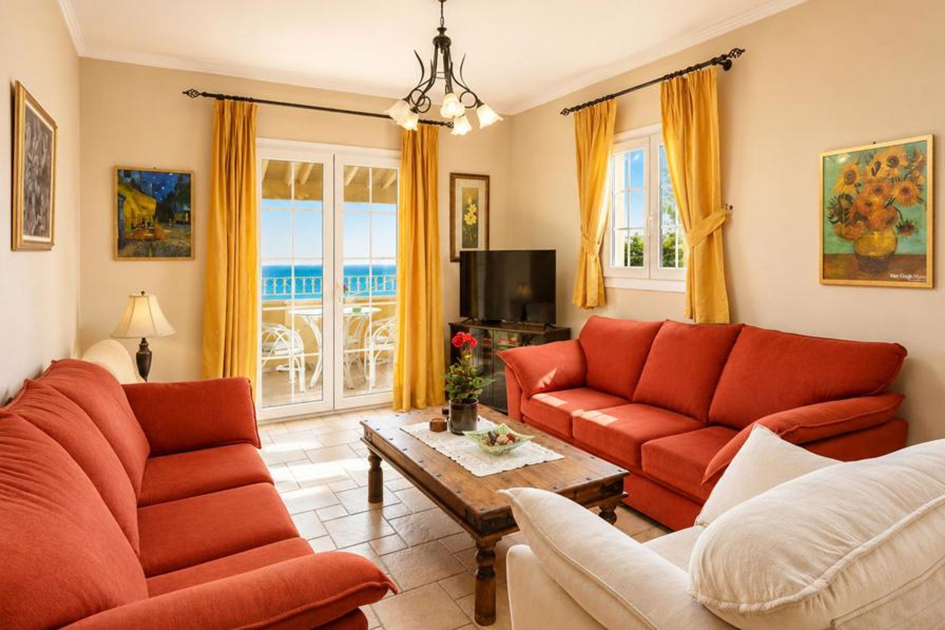 Living room on first floor with sofas, WiFi internet, satellite TV, and balcony access