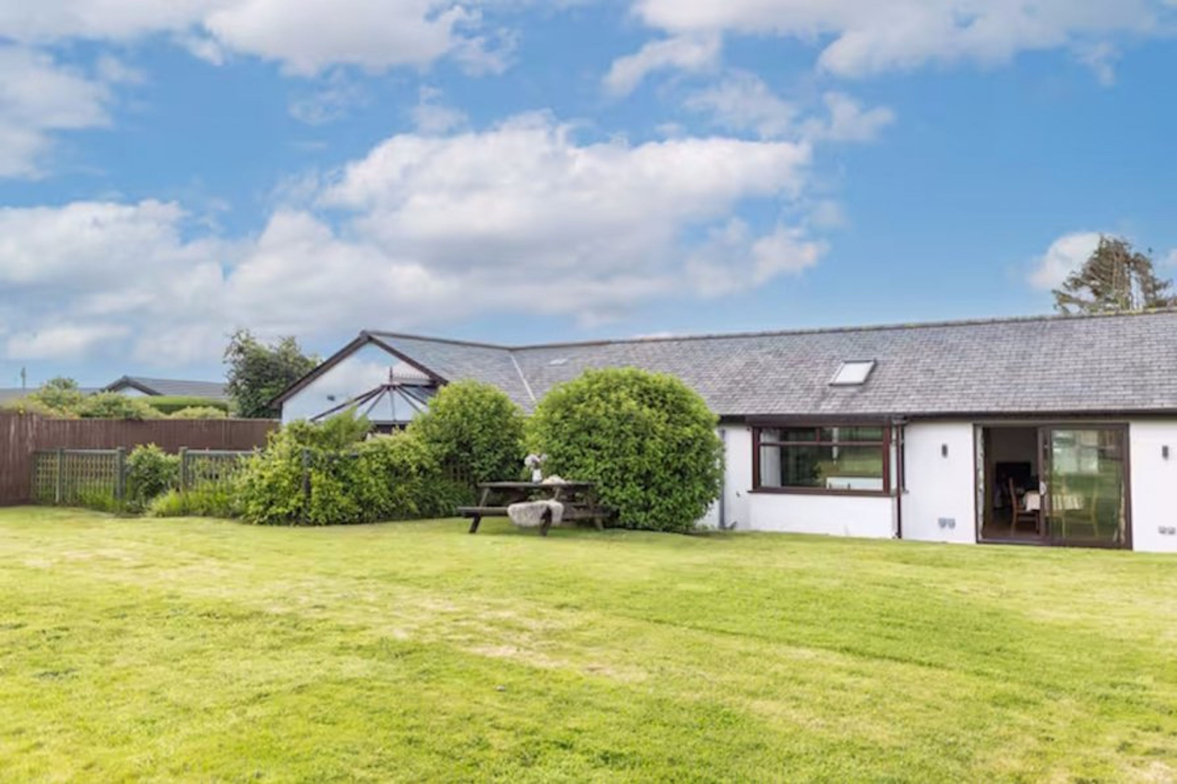 The large private rear garden secure for children and dogs to play.