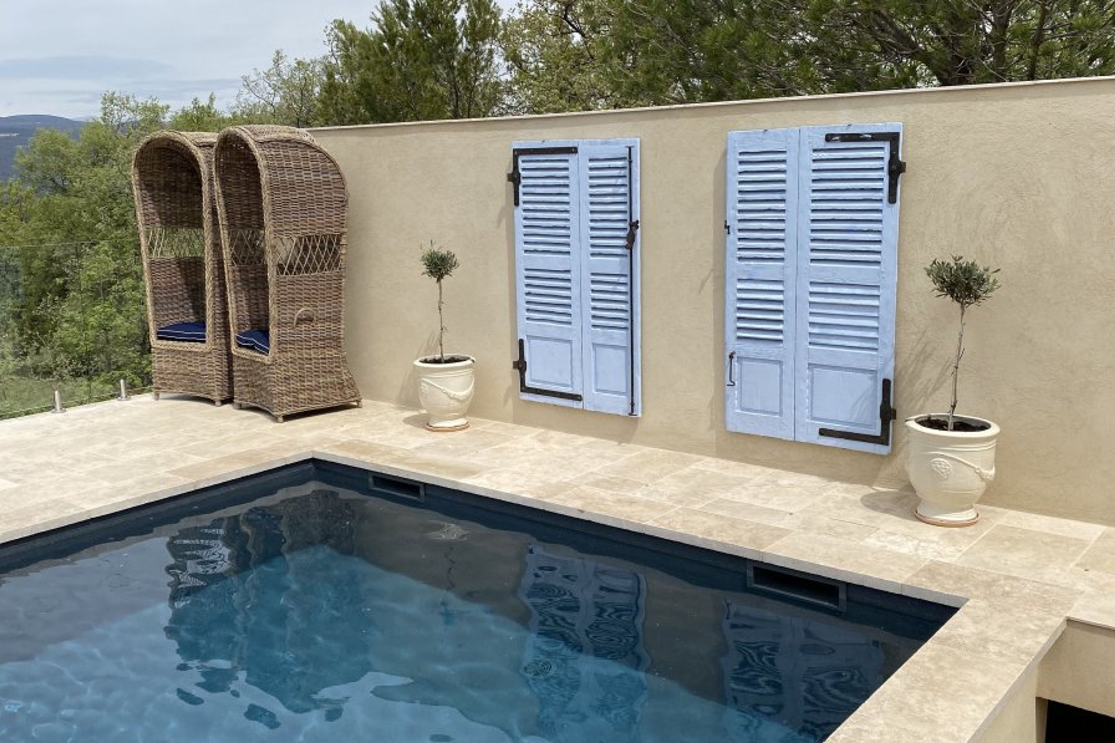 Pool wall keeps the area cozy and intimate