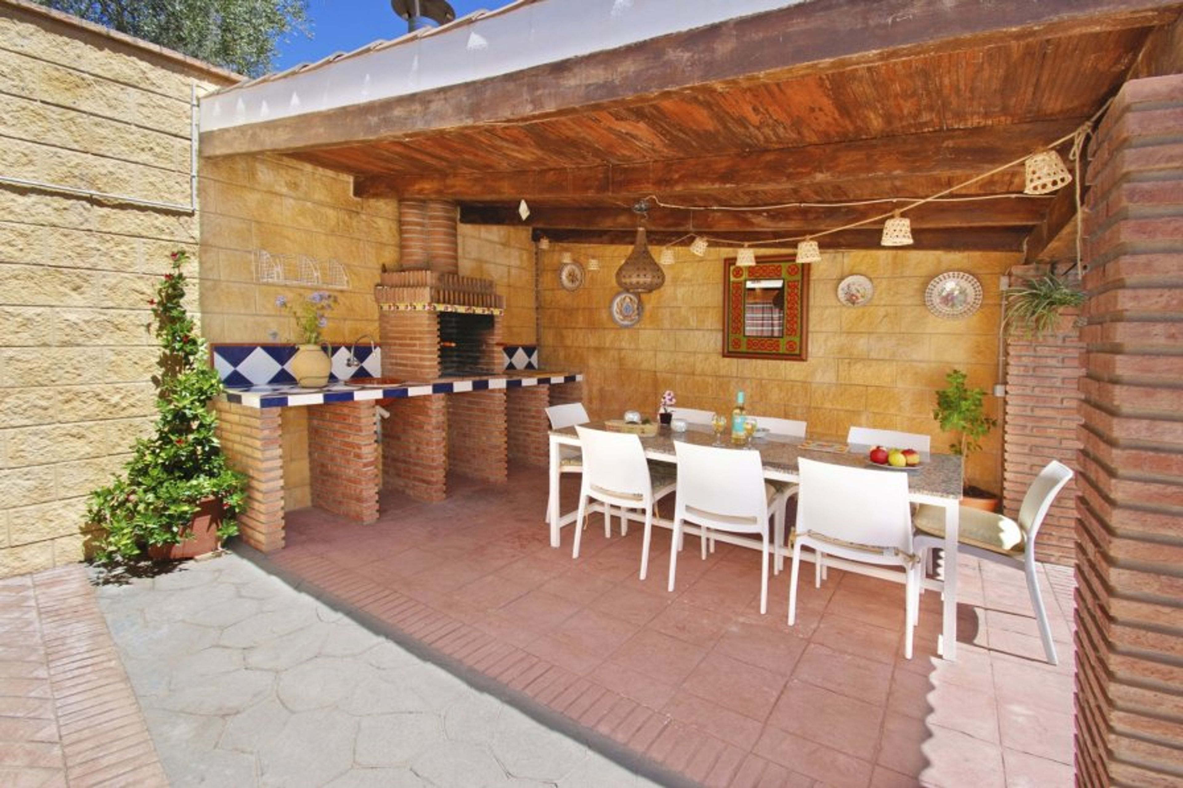Our outside dining table. The patio offers shade in Summer.
