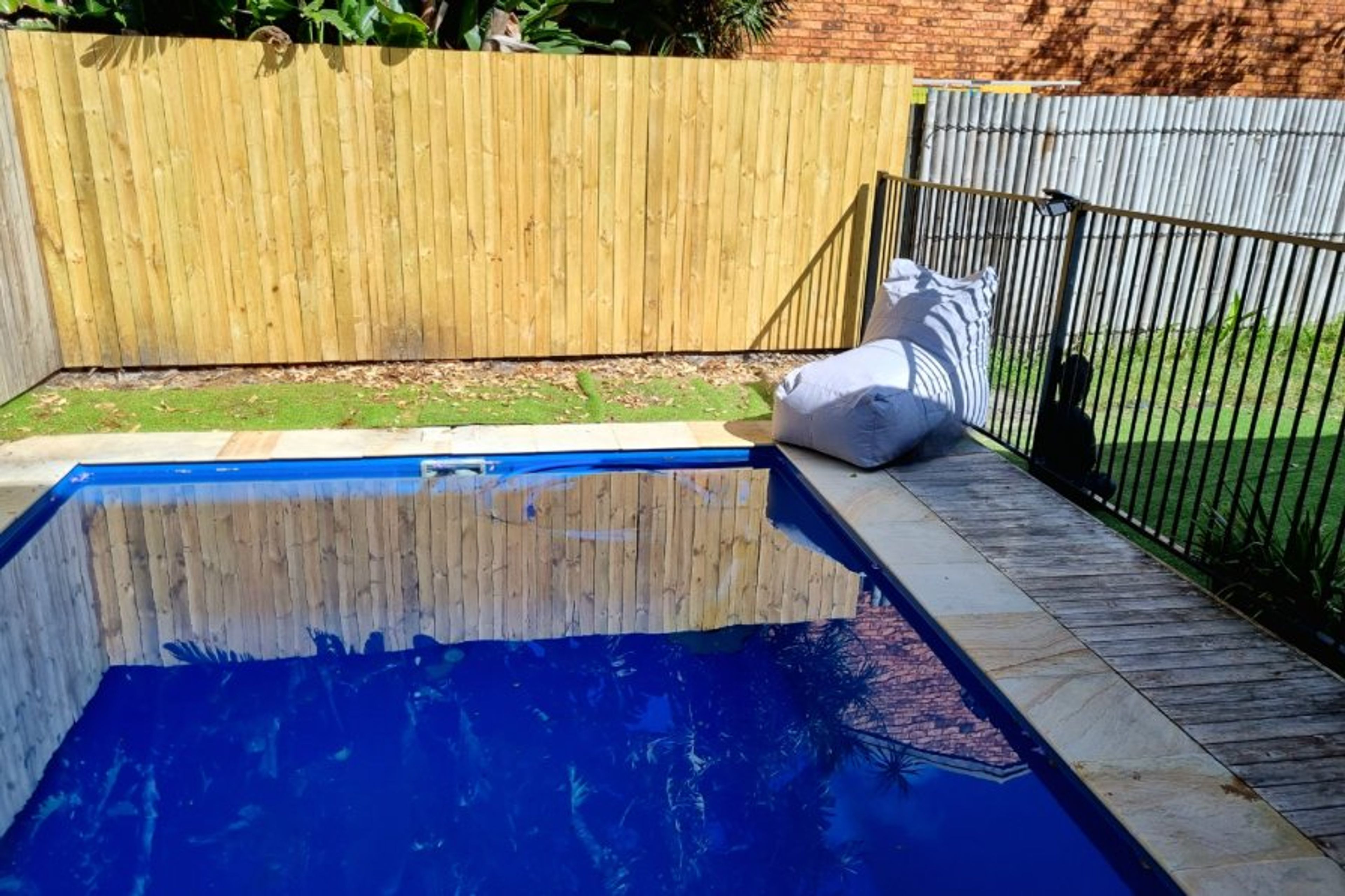 gorgeous plunge pool featuring Buddha statues