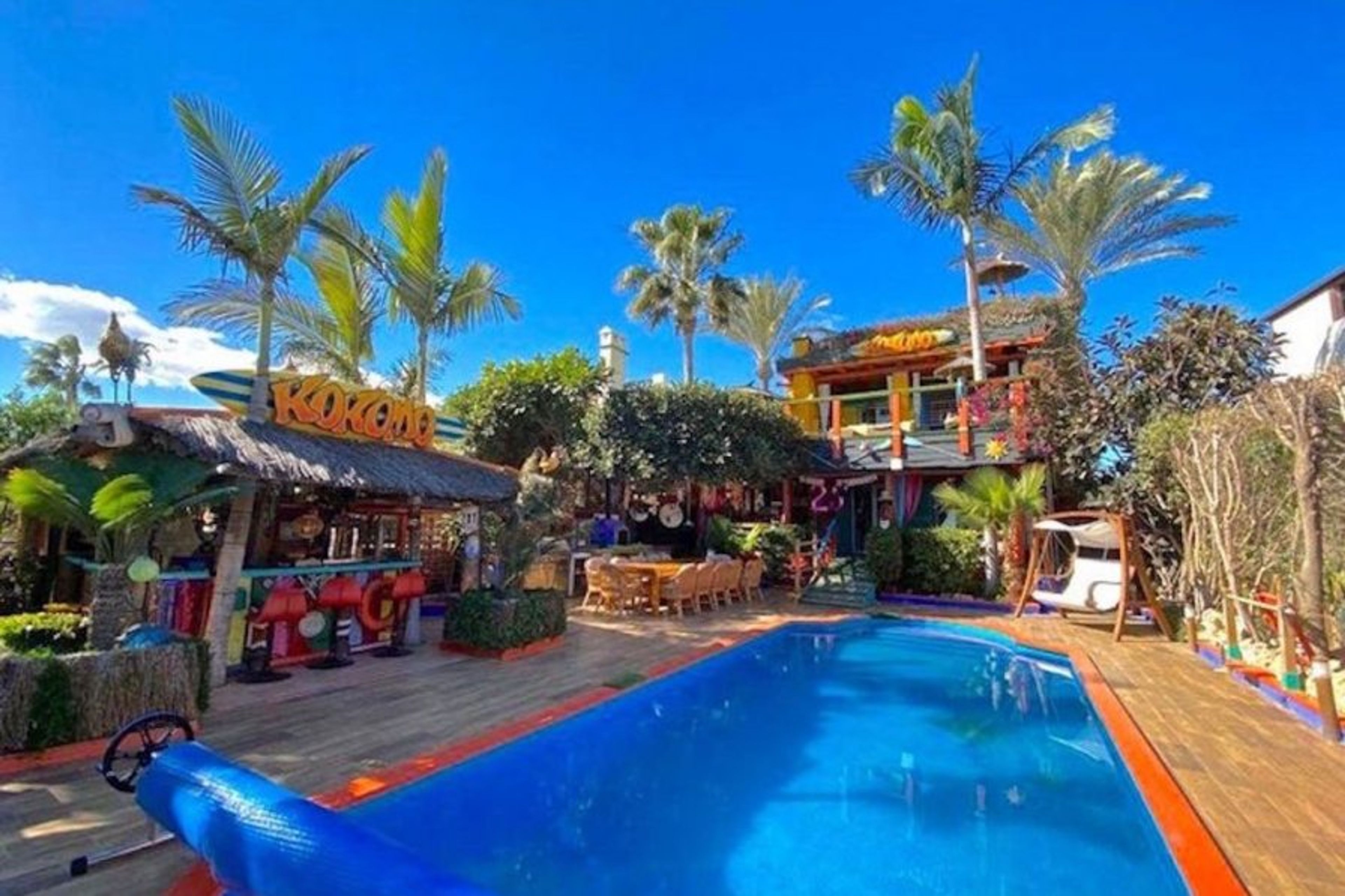 Kokomo Pool terrace, dining area & garden Bar.  