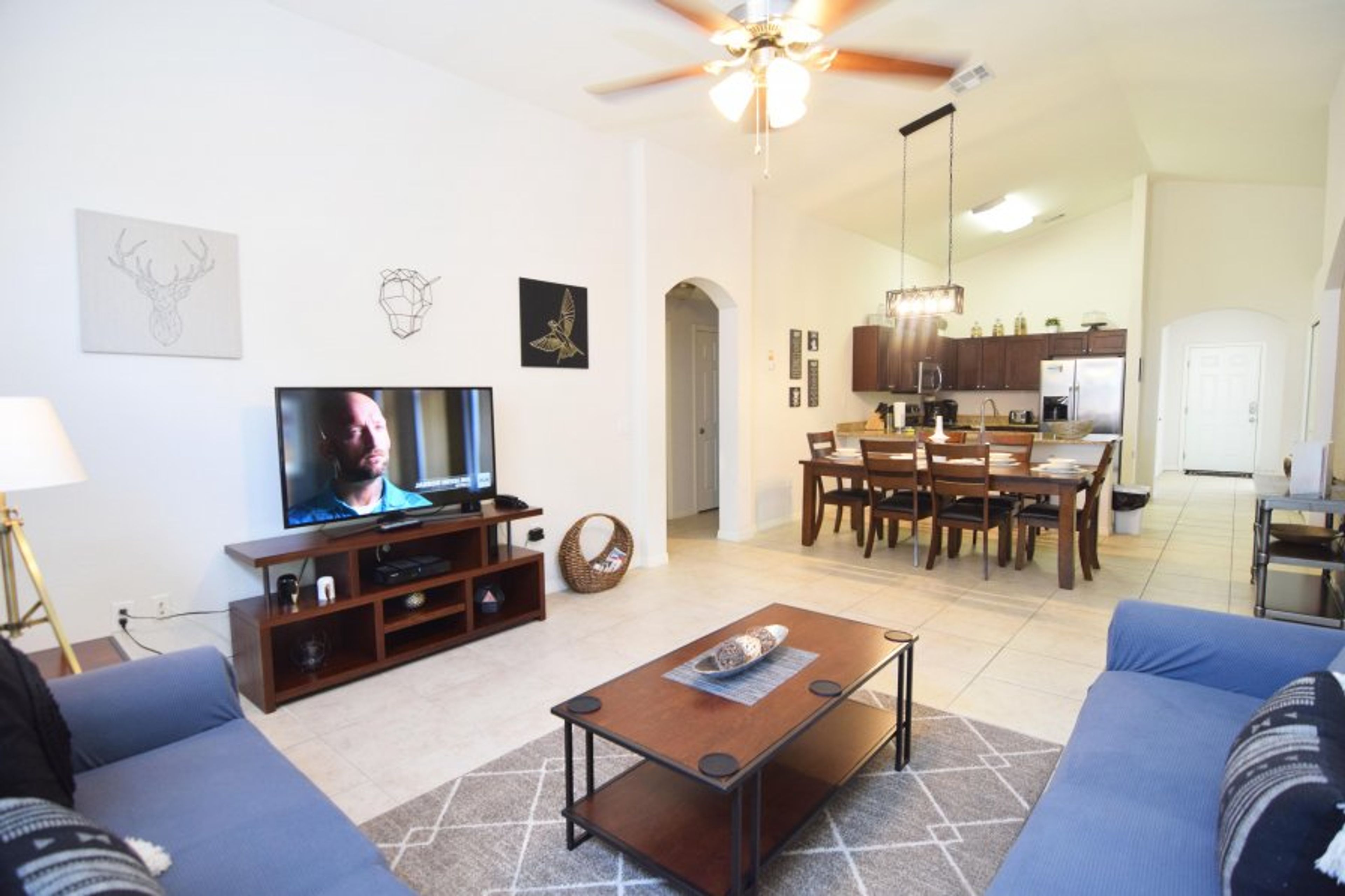 Spacious open-plan living space with lounge, dining area, kitchen