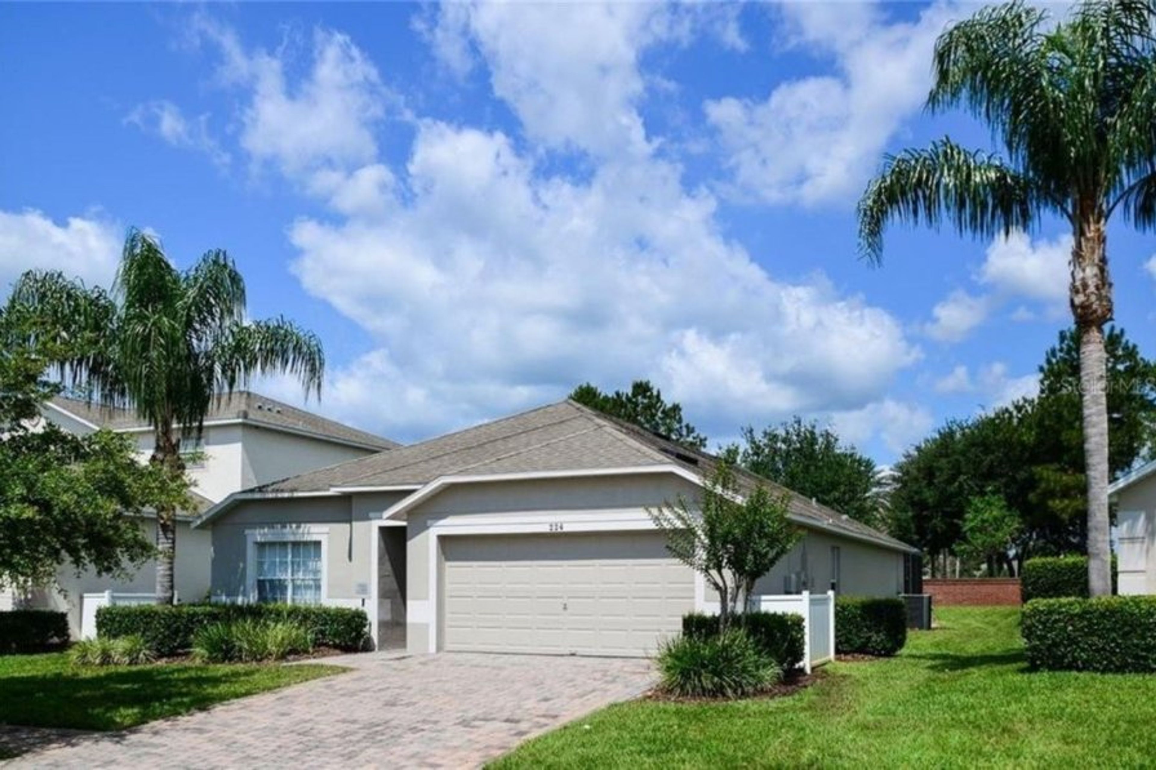 Front of this stylish updated home with west-facing private pool, game