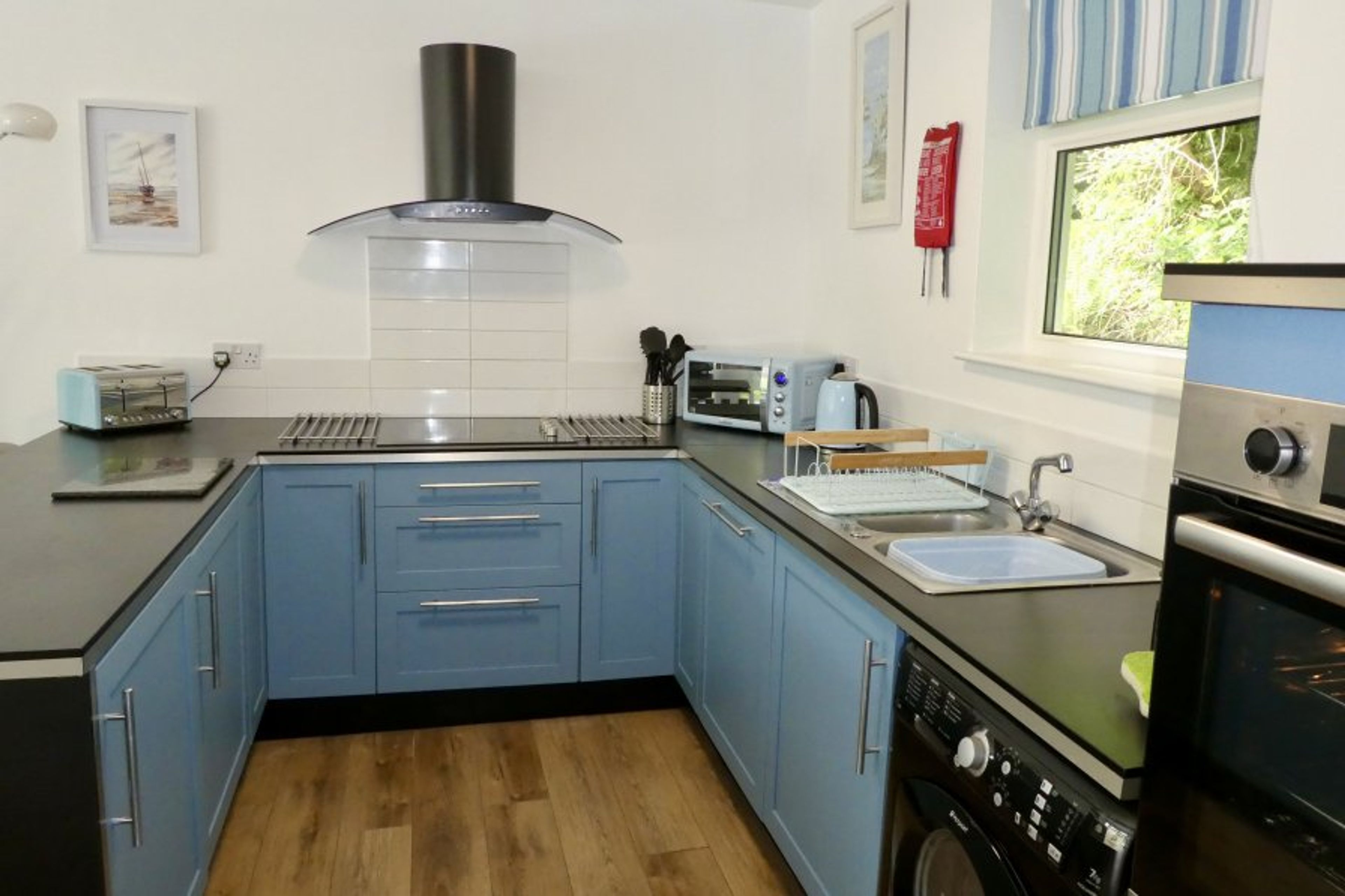 Fully fitted kitchen with integrated fridge, freezer, dishwasher. 
