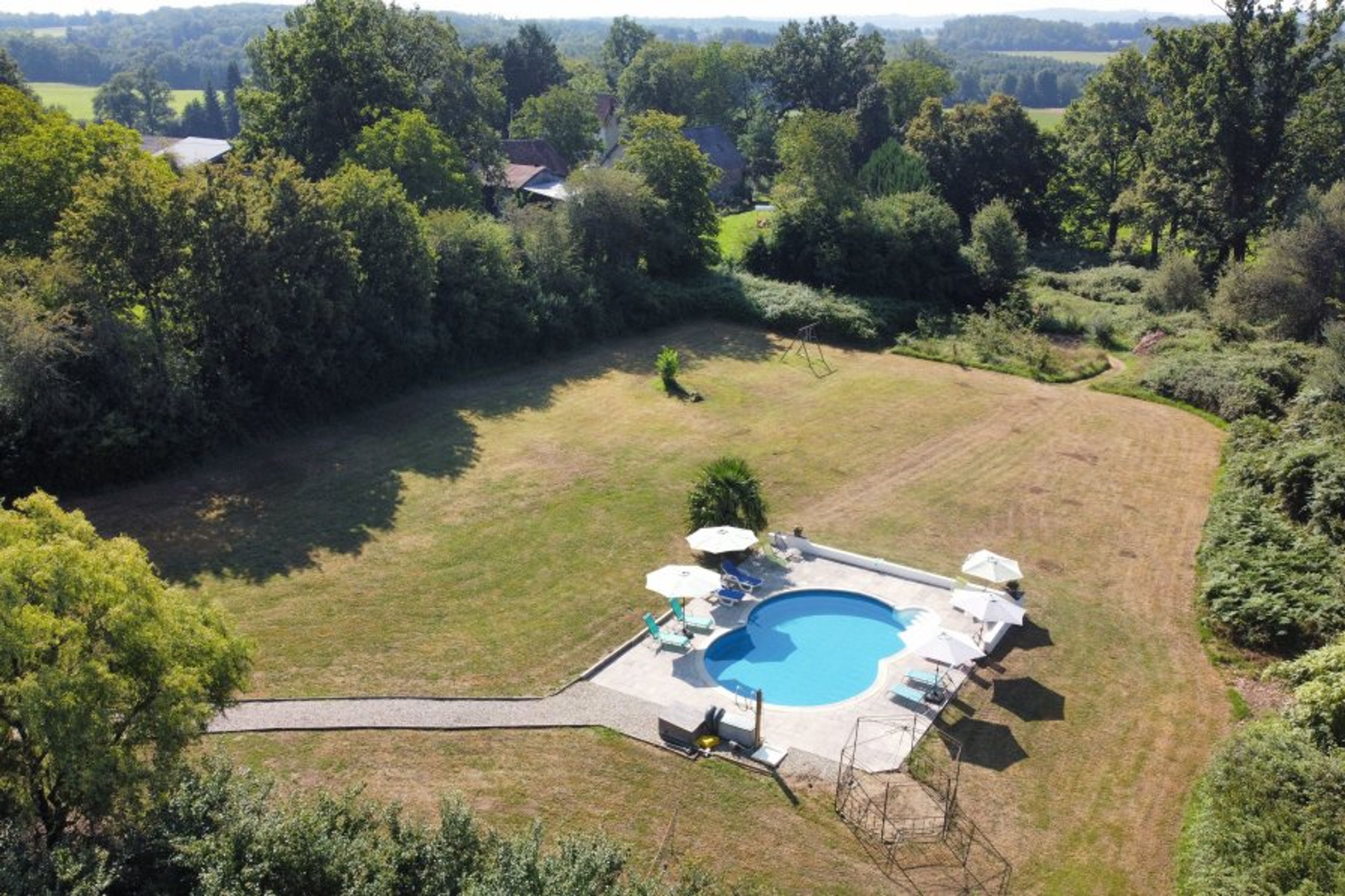 Pool with large grass area for various games