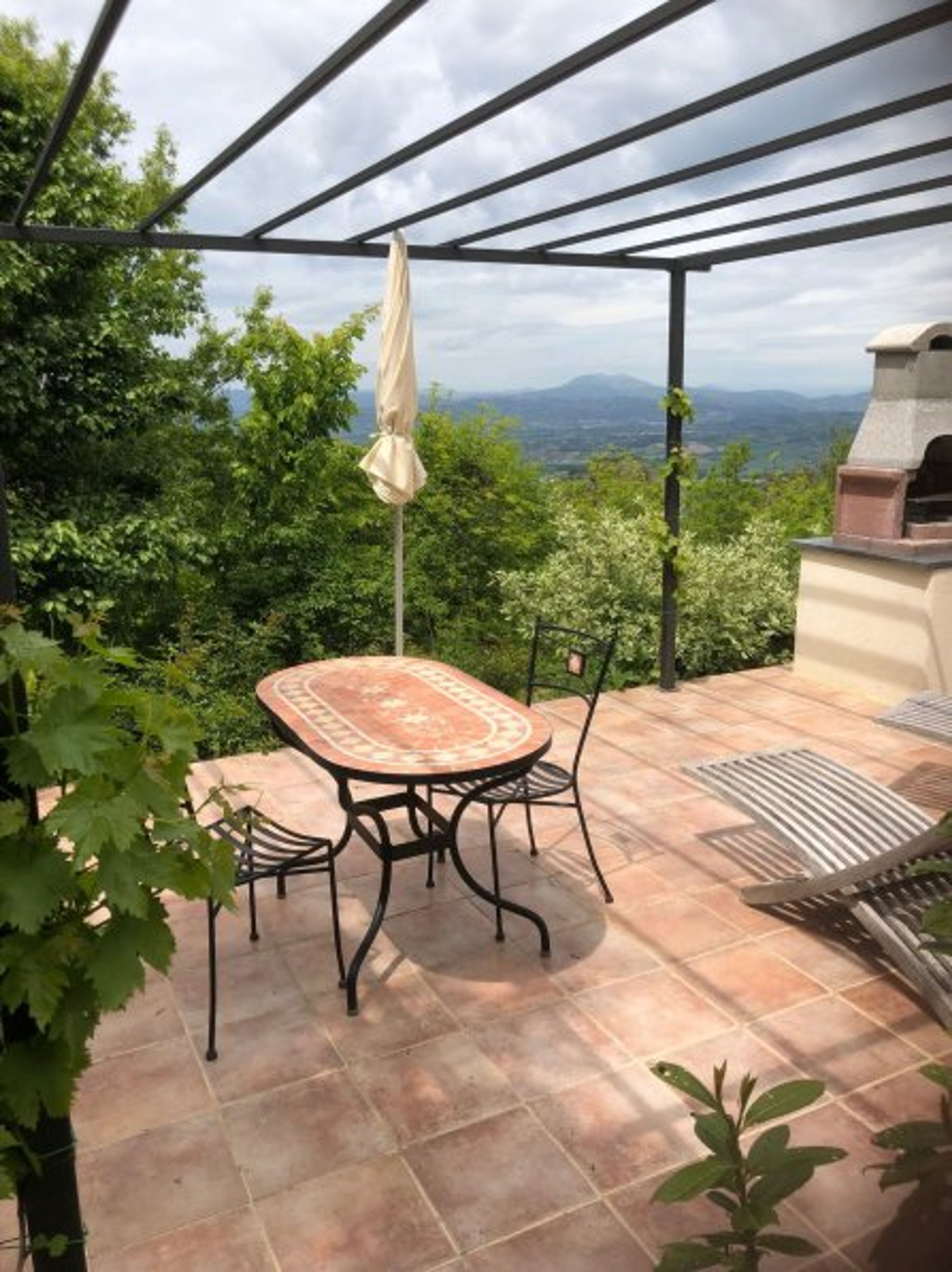 your private terrace with seats table and barbecue