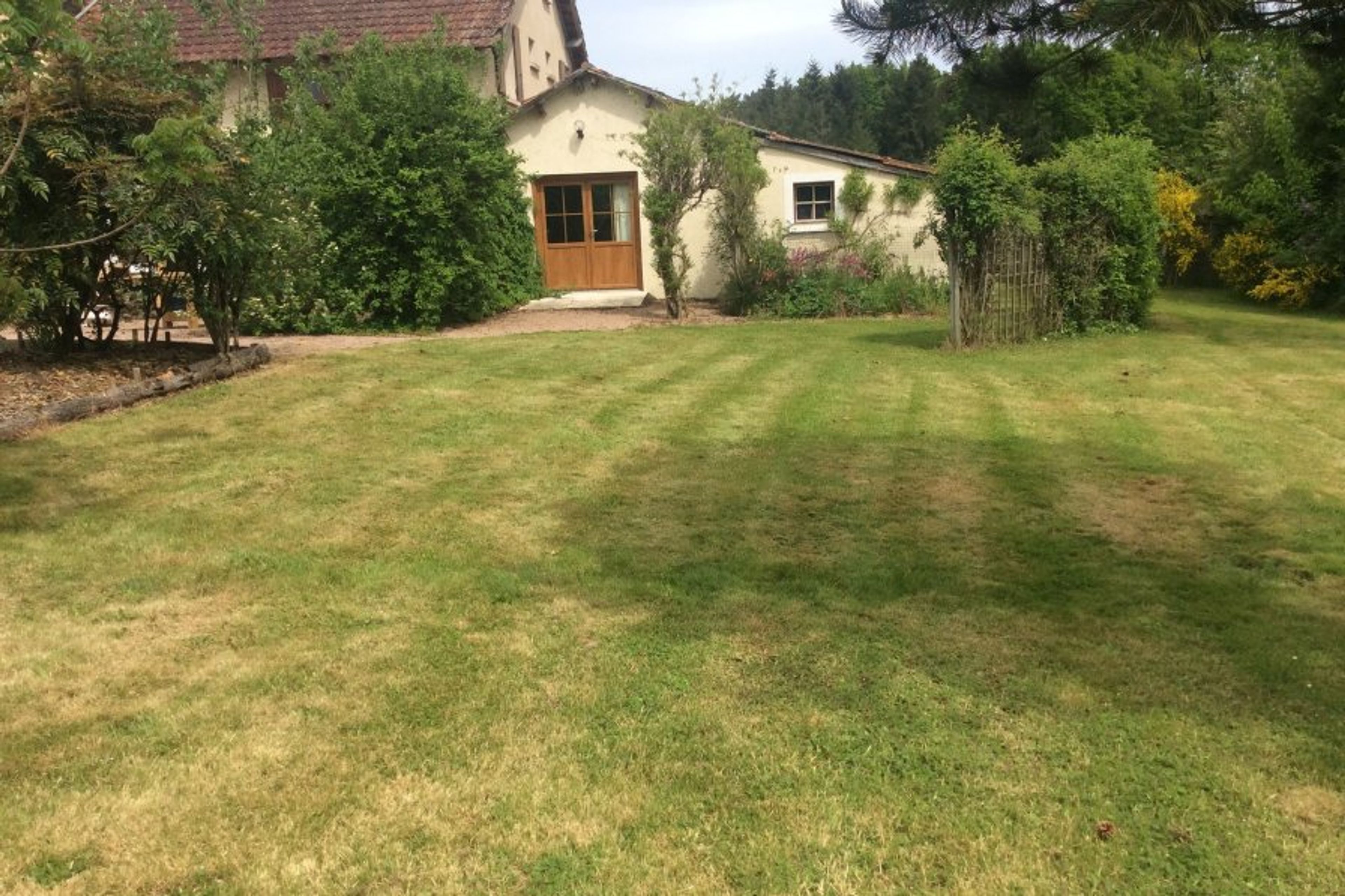 Front of L’ecurie looking from across the lawns . 