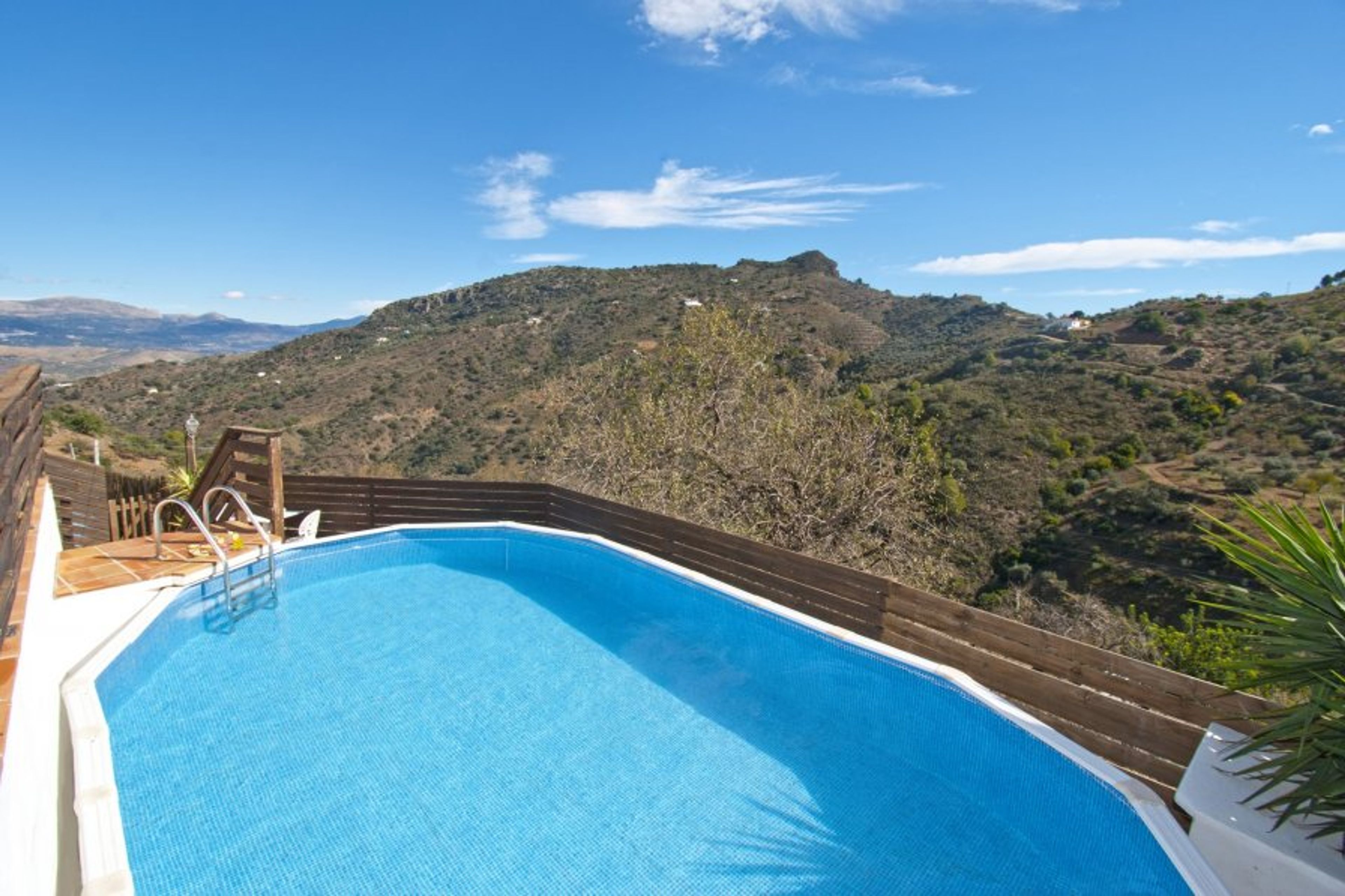 Enjoy a stunning nature views from this poolside oasis.