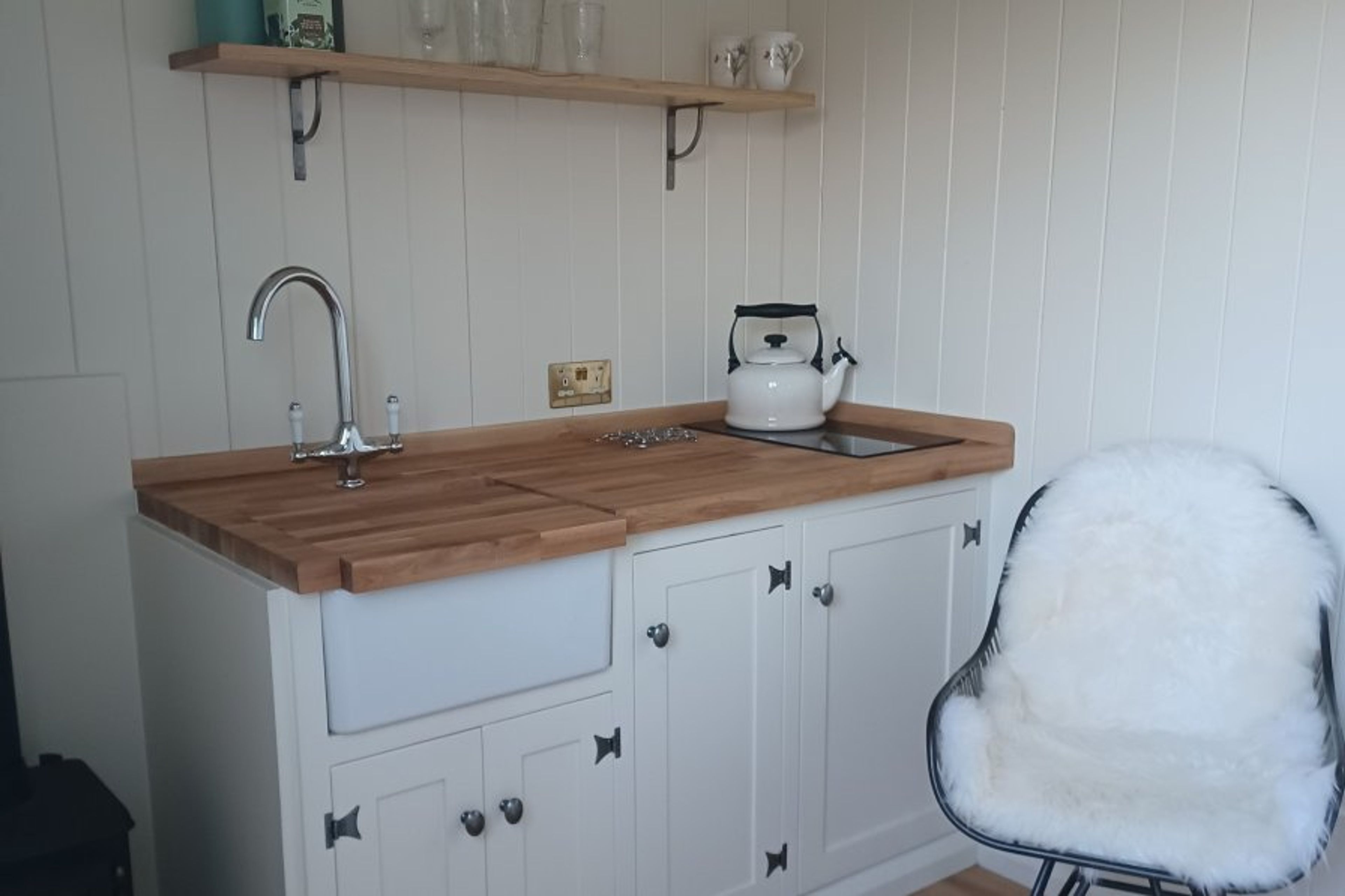 Food prep area with sink, hob and fridge