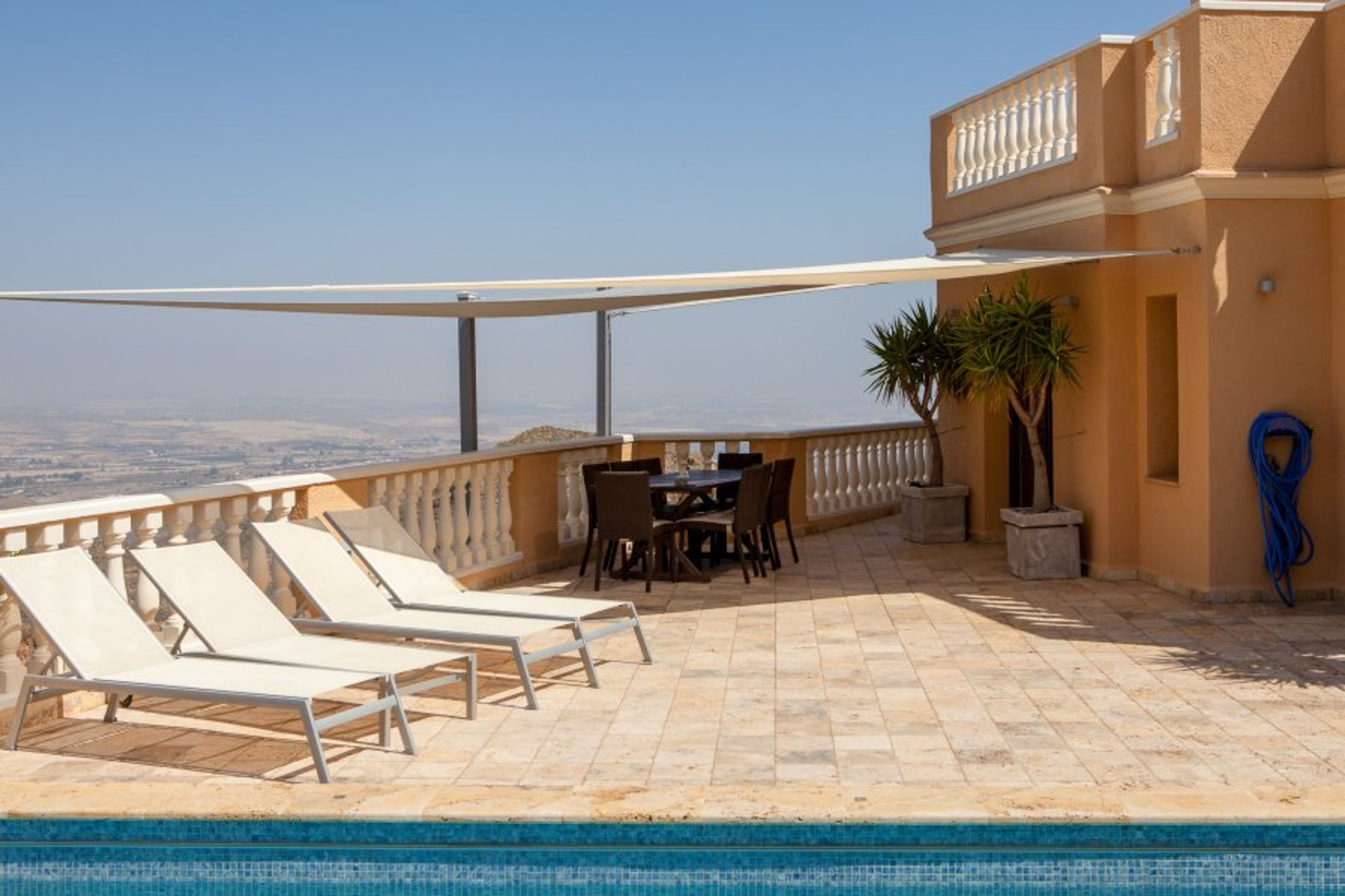 Sun loungers and Table for 8 for al fresco dining on the terrace