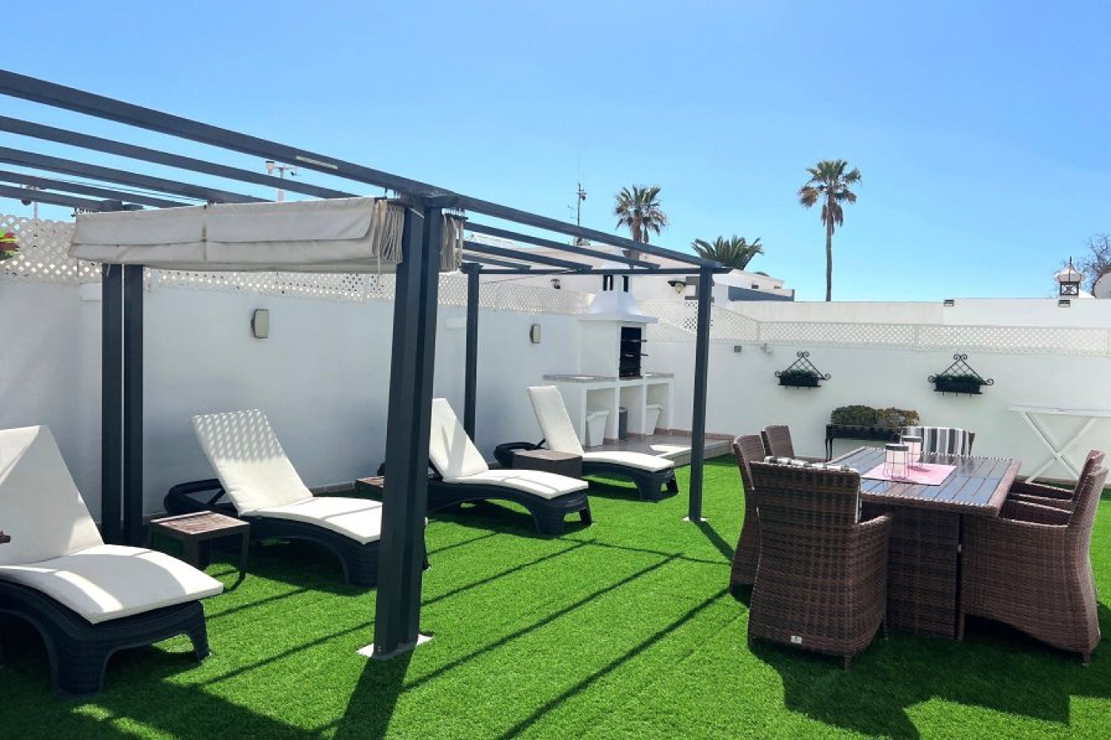 rear garden with access to gated heated pool