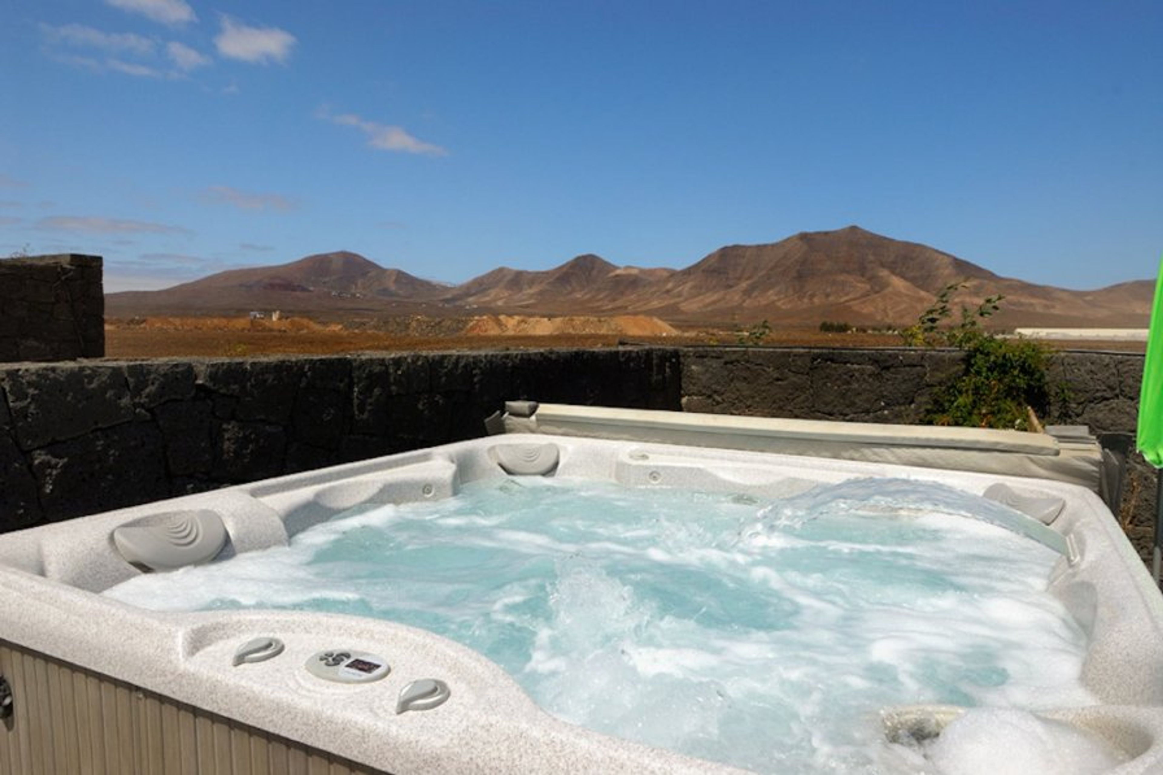 lovely hot tub with fantastic views of the mountains