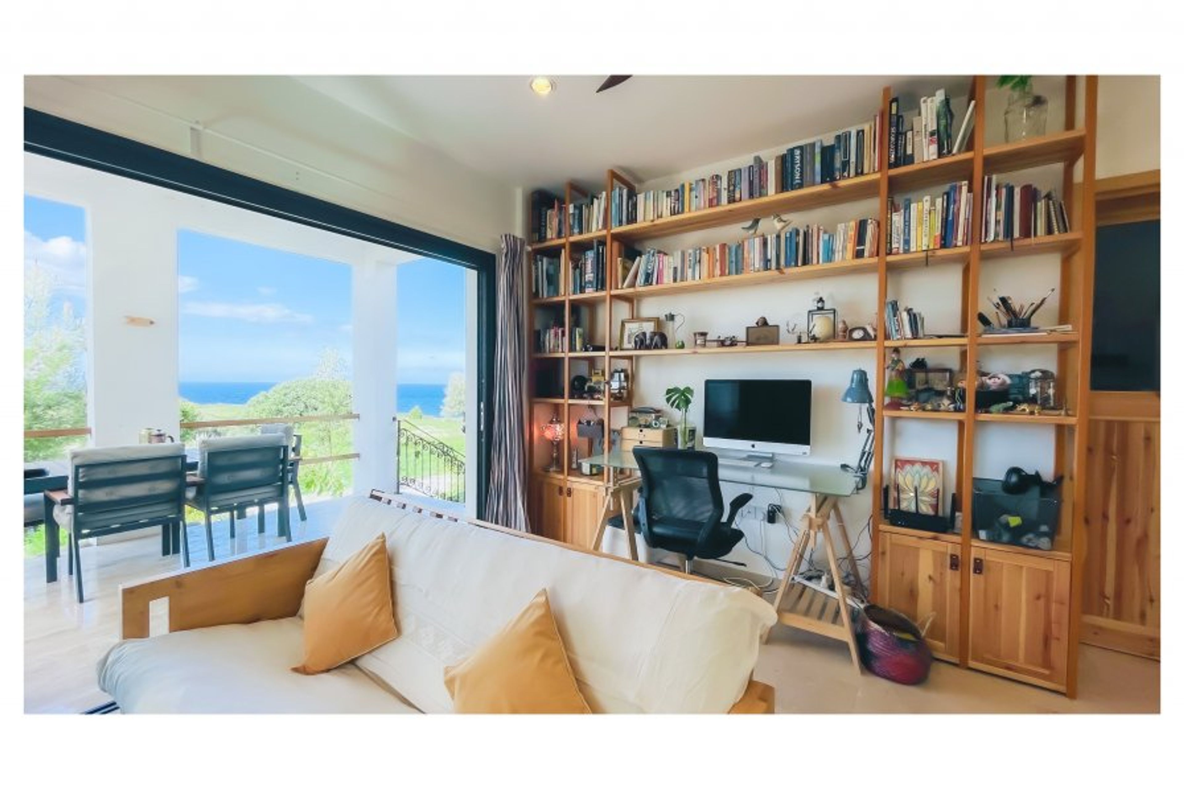 Living space and front verandah with stunning sea views