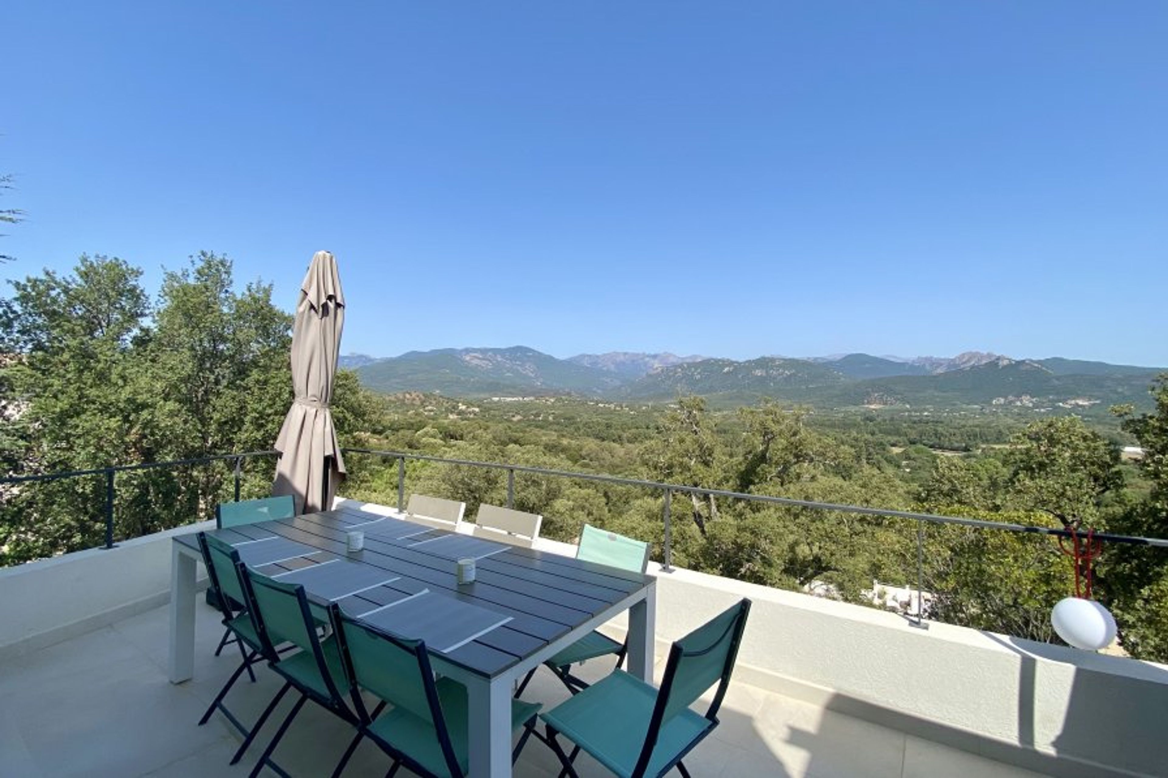 Exterior dining space with mountain view