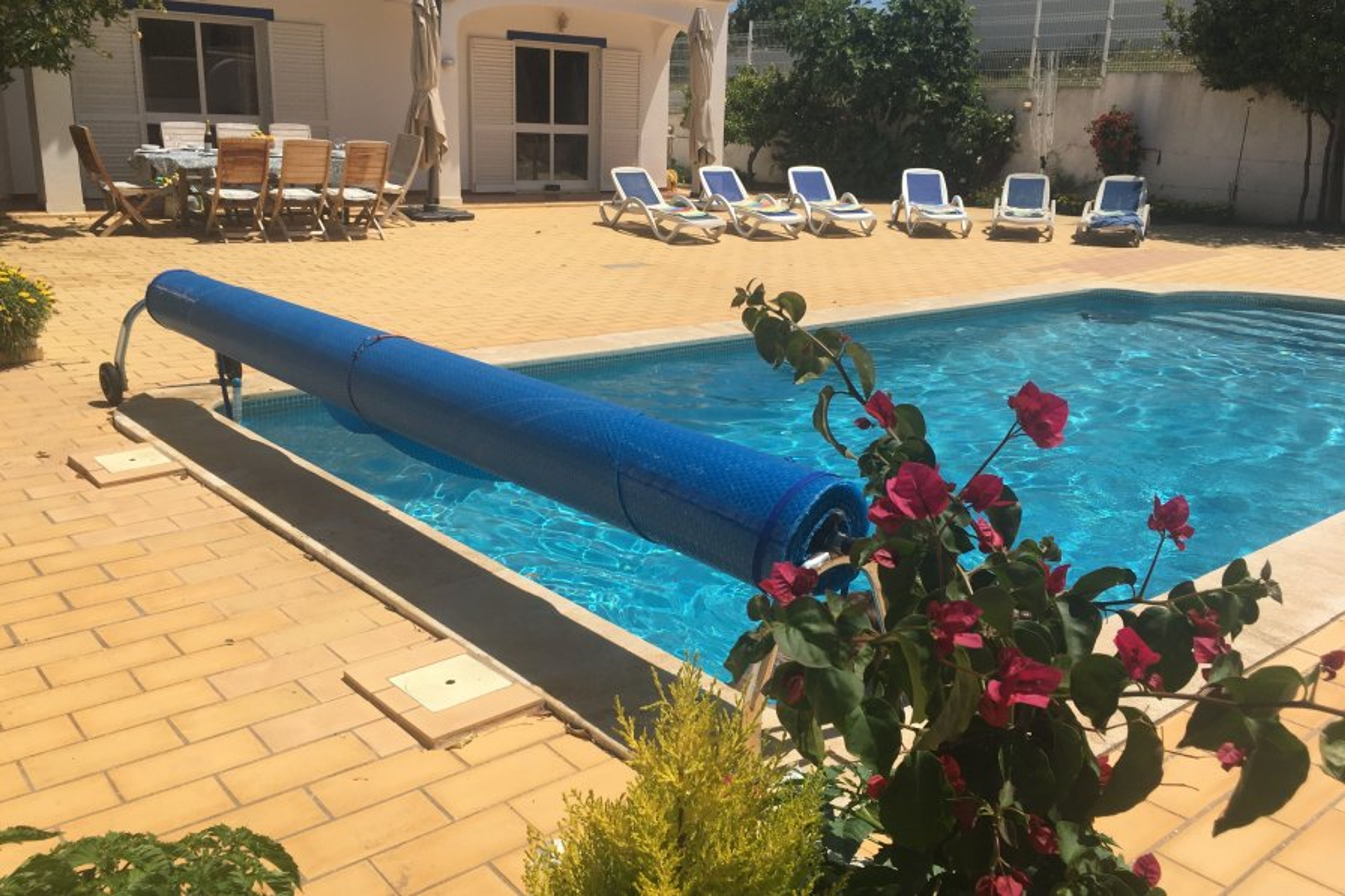 Terrace with private heated pool, dining table and sun loungers
