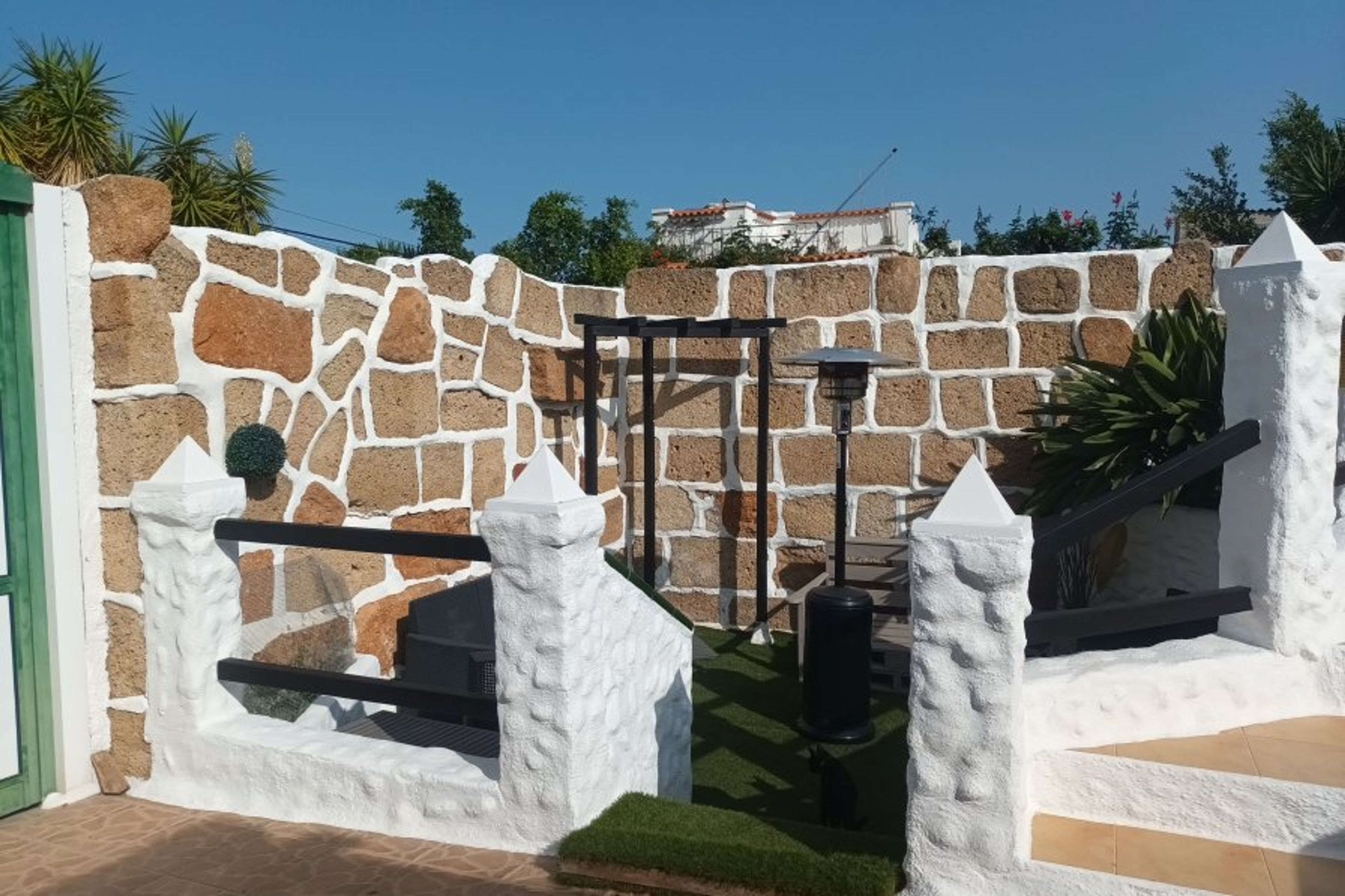 View from sunbathing area to lower level chillout area