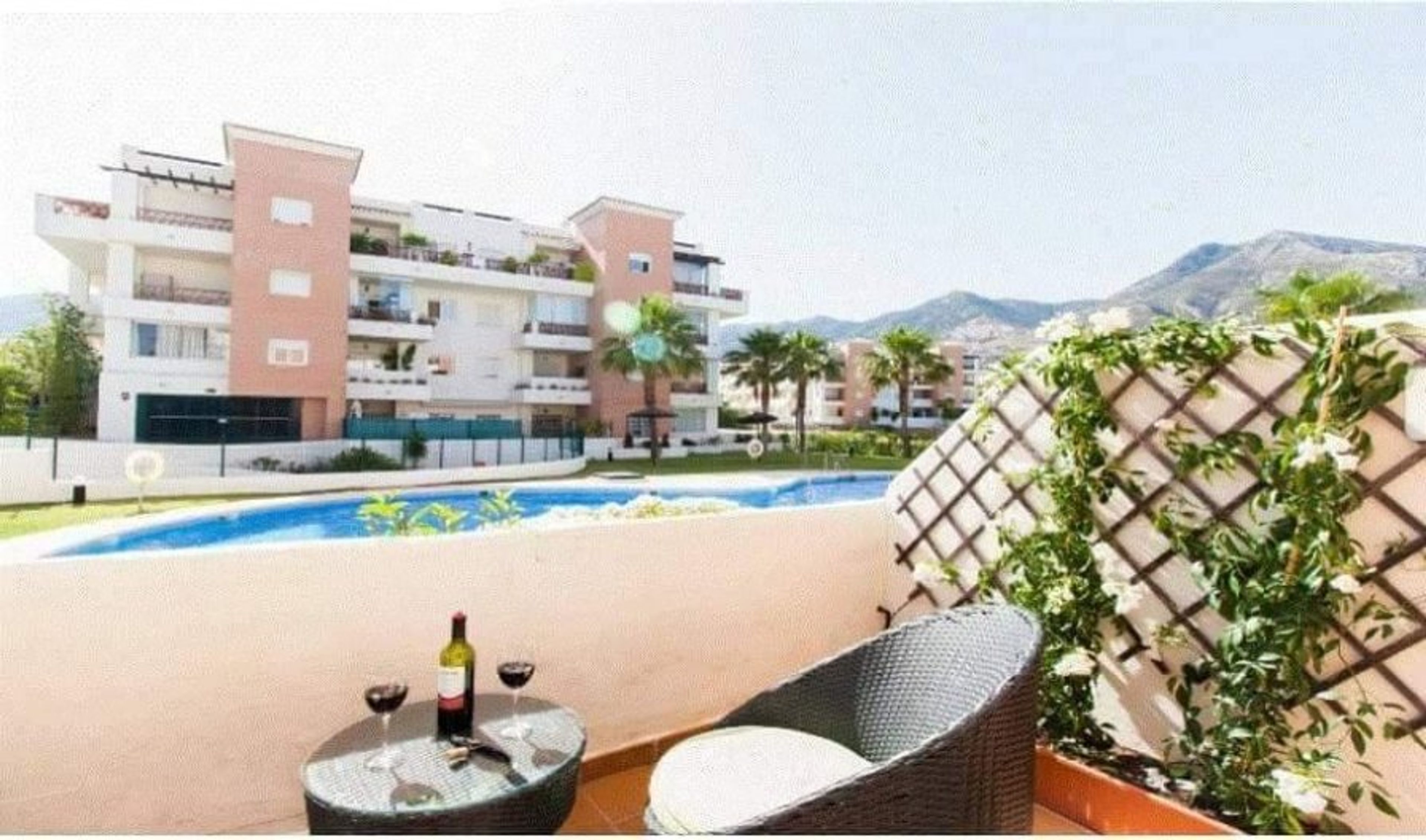 Small terrace off the master bedroom with pool and mountain views.