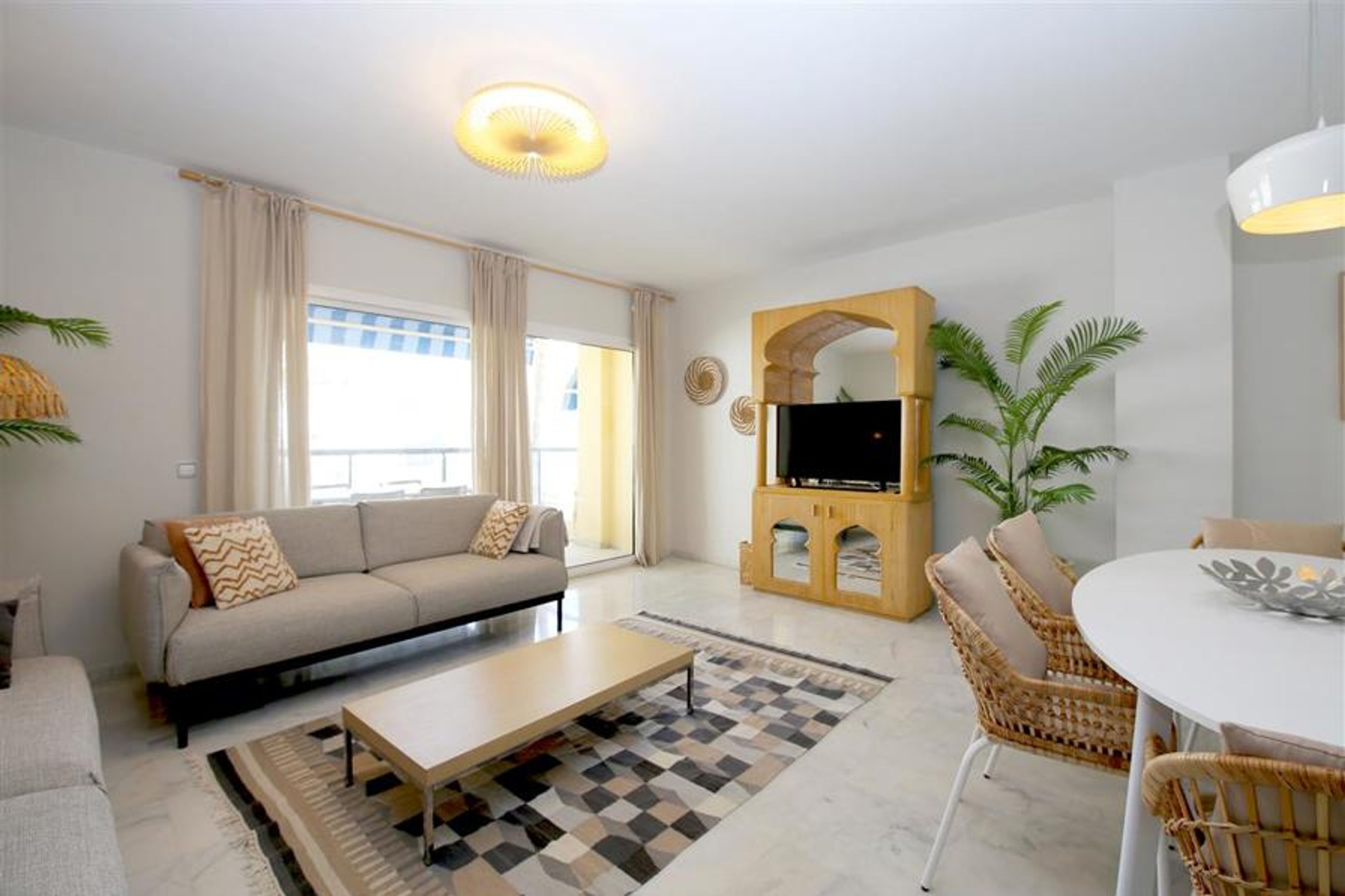 Modern and bright lounge with access to the terrac