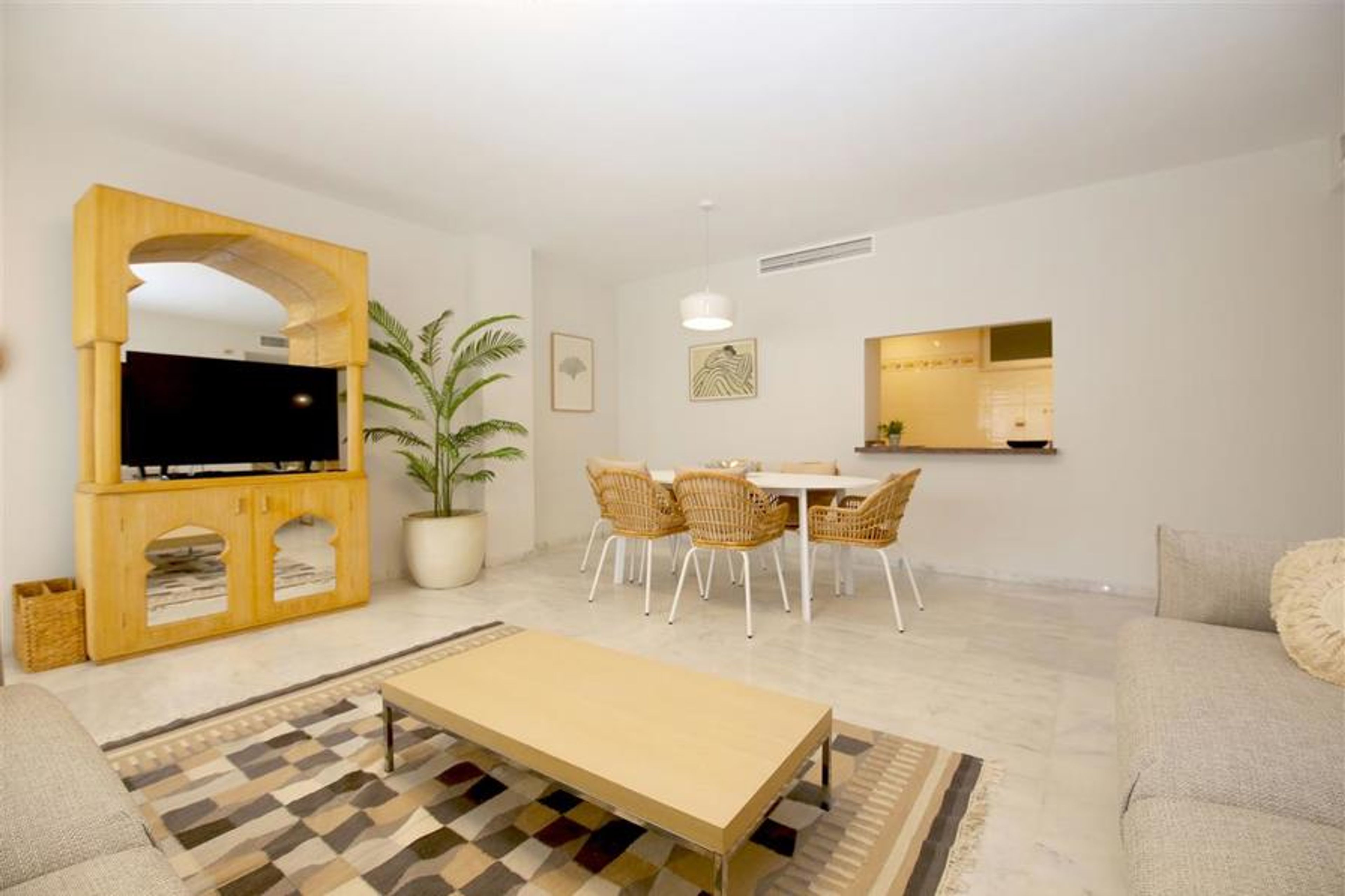 Another picture of the lounge with dining area to