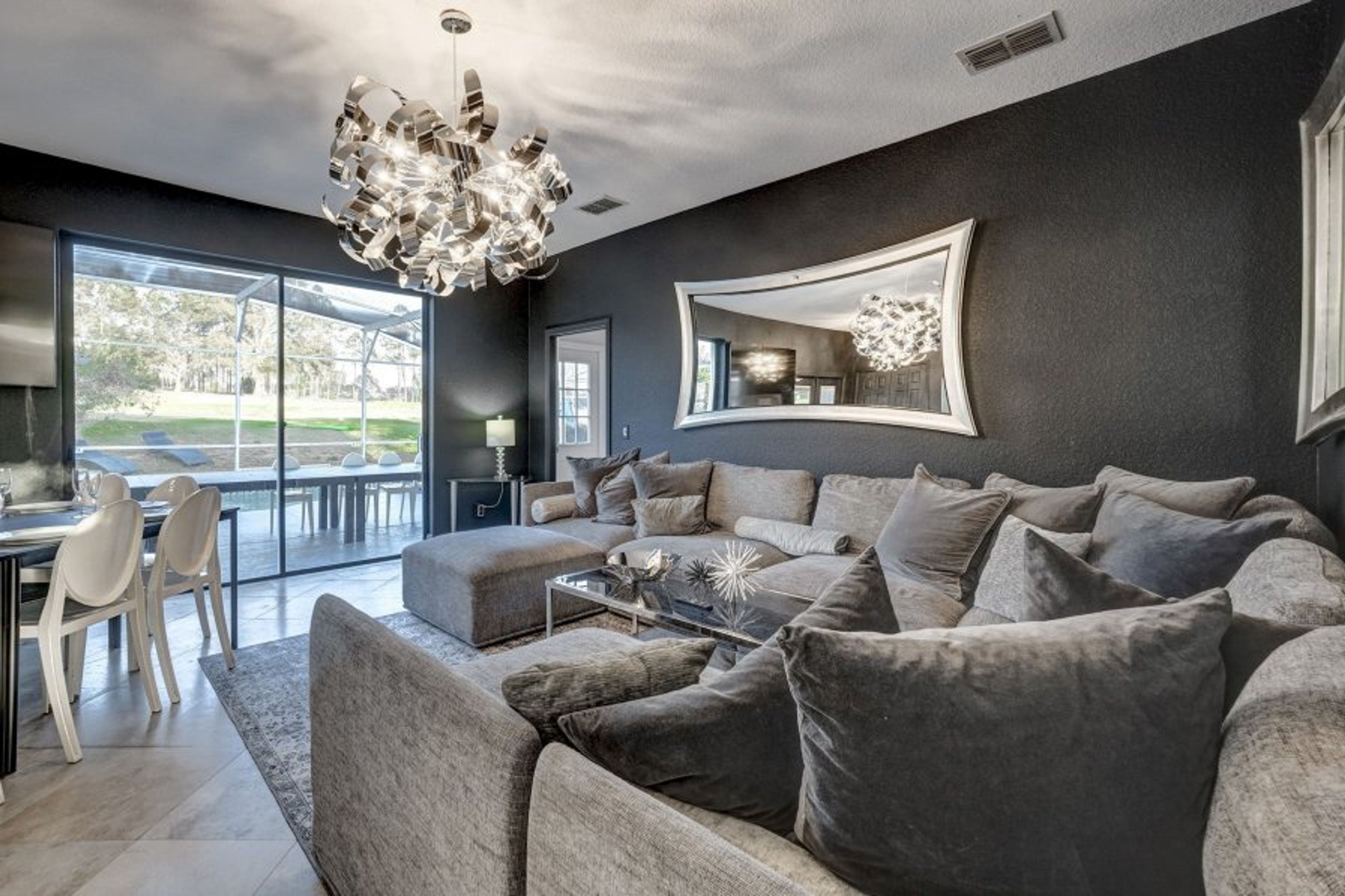 Comfortable and Entertaining living room with open floorplan to socialize with dining room as well. Start with a cocktail and move onto dining in modern social atmosphere catering for your entire family, bachelor/birthday party or corporate retreat.
