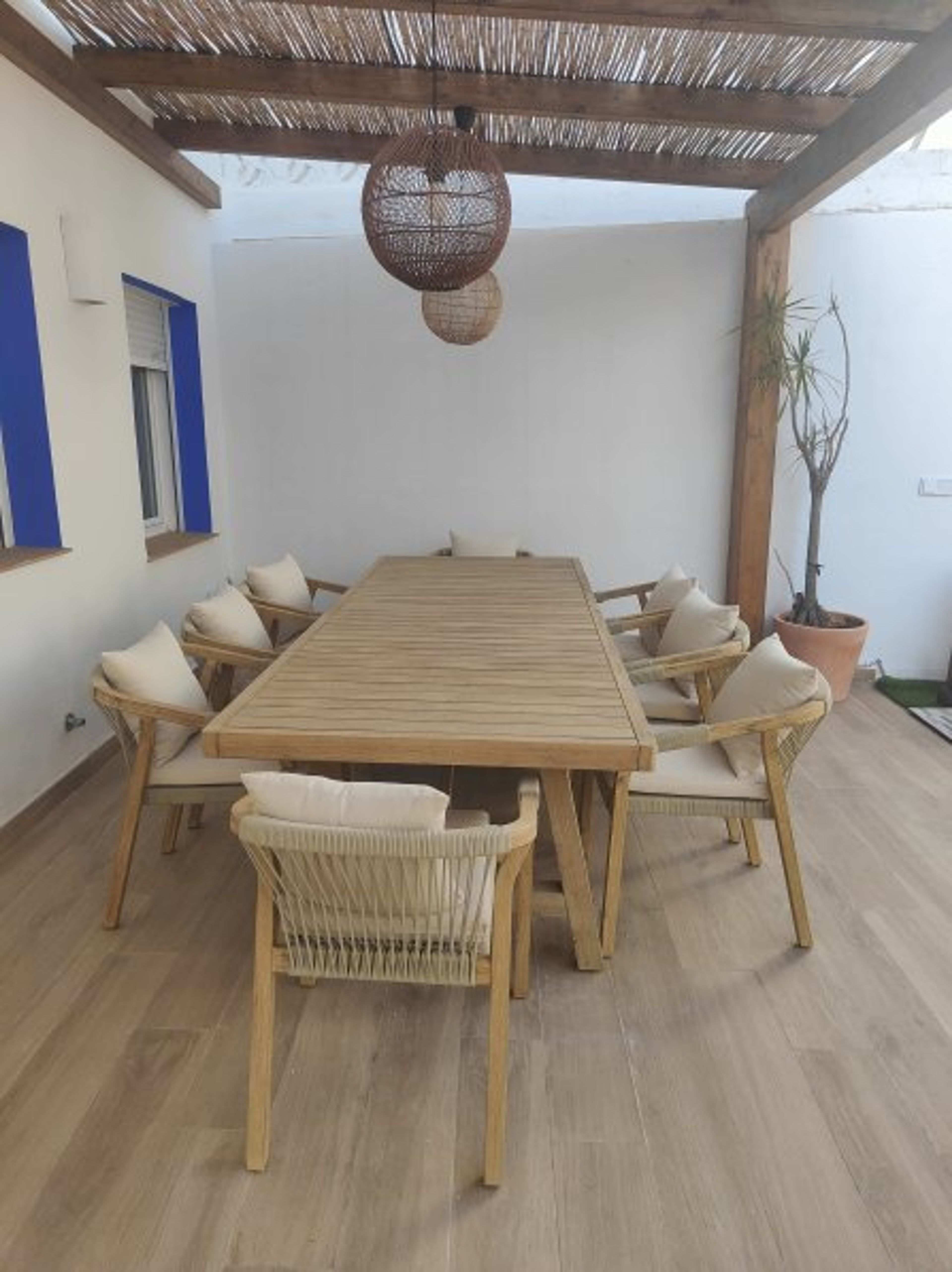Dining room in private yard. Acacia wood table for 10 people