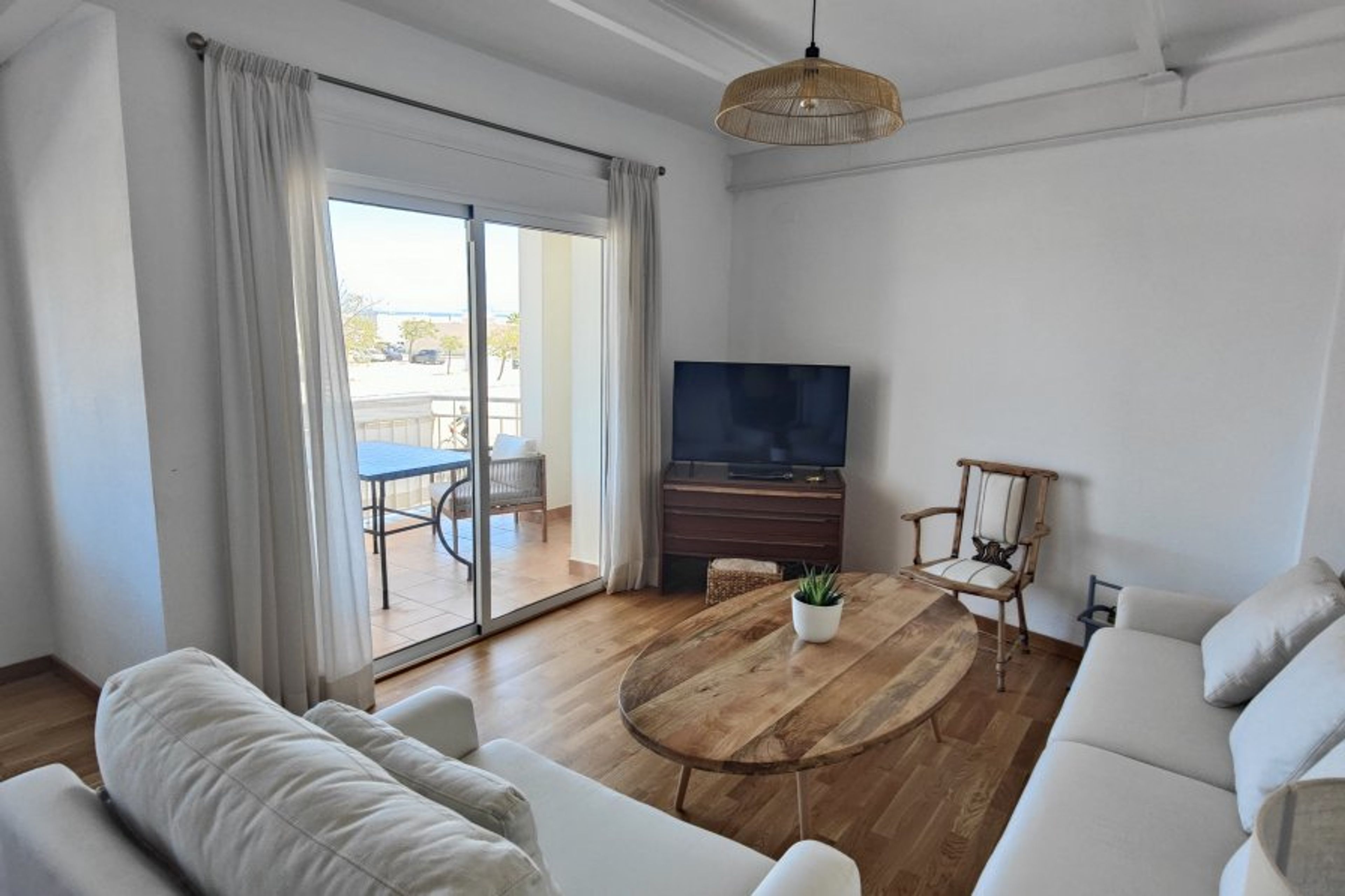 Living room with access to terrace. Oak wood floor.