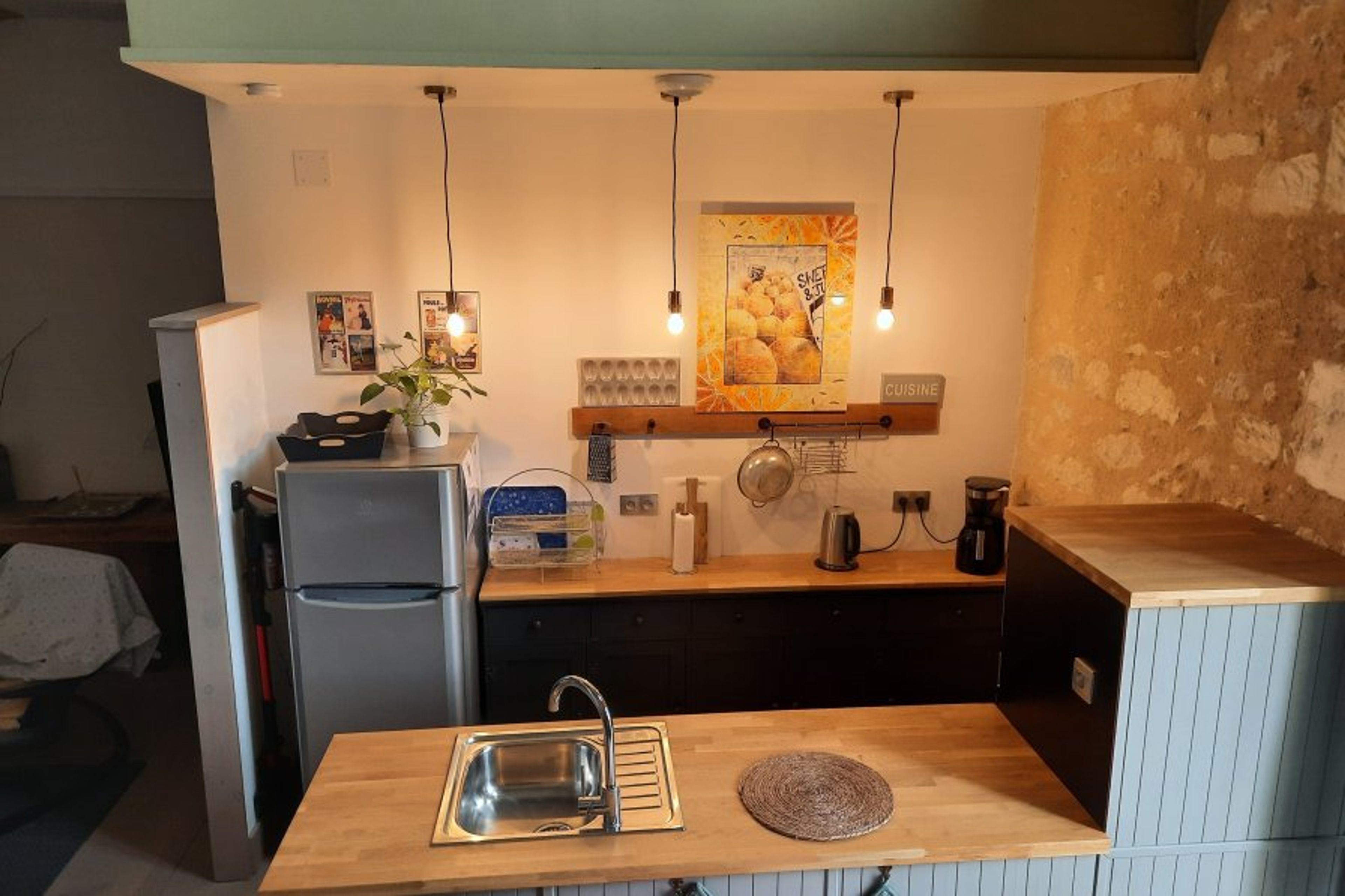 Open plan ground floor with fully equipped kitchen.