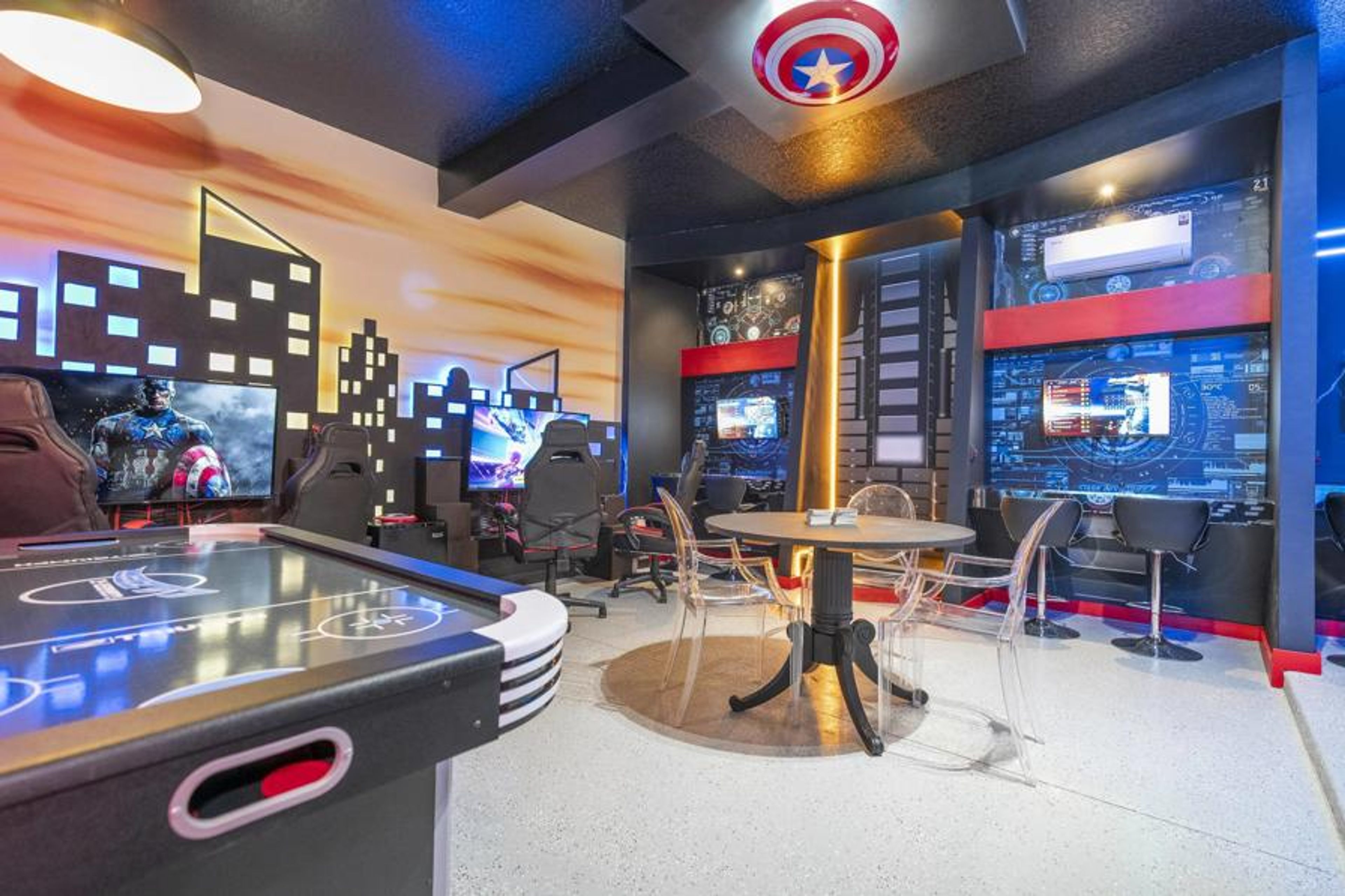 Enjoy our lively game room featuring stylish gaming chairs and multiple screens, all set against a stunning cityscape mural. With colorful LED lighting, it’s the perfect place for fun gatherings with friends and family.
