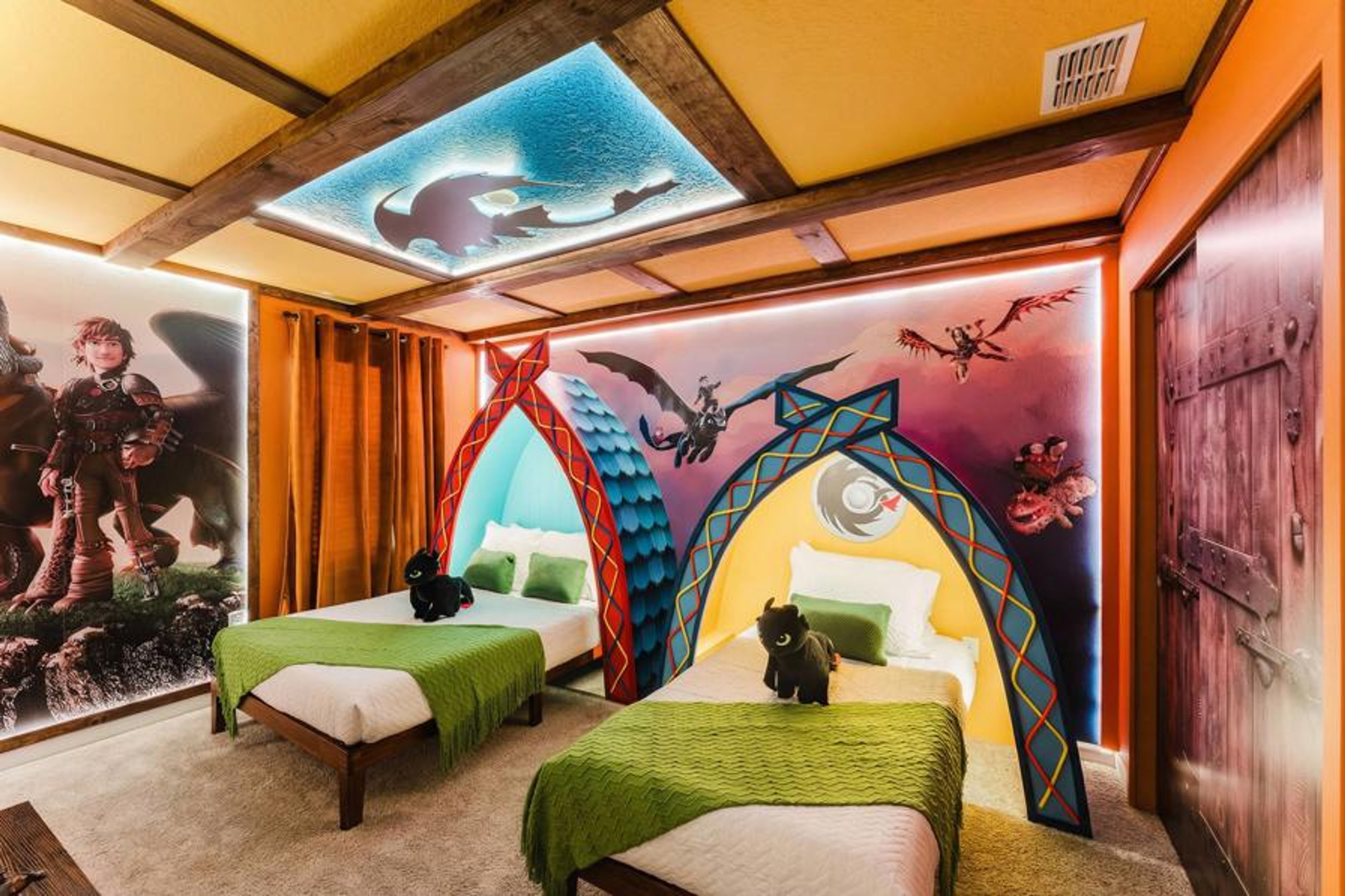 Enjoy a whimsical atmosphere in this unique bedroom with colorful murals, playful archways, and two cozy beds in vibrant green linens, all complemented by a softly lit ceiling that invites relaxation and sparks creativity.
