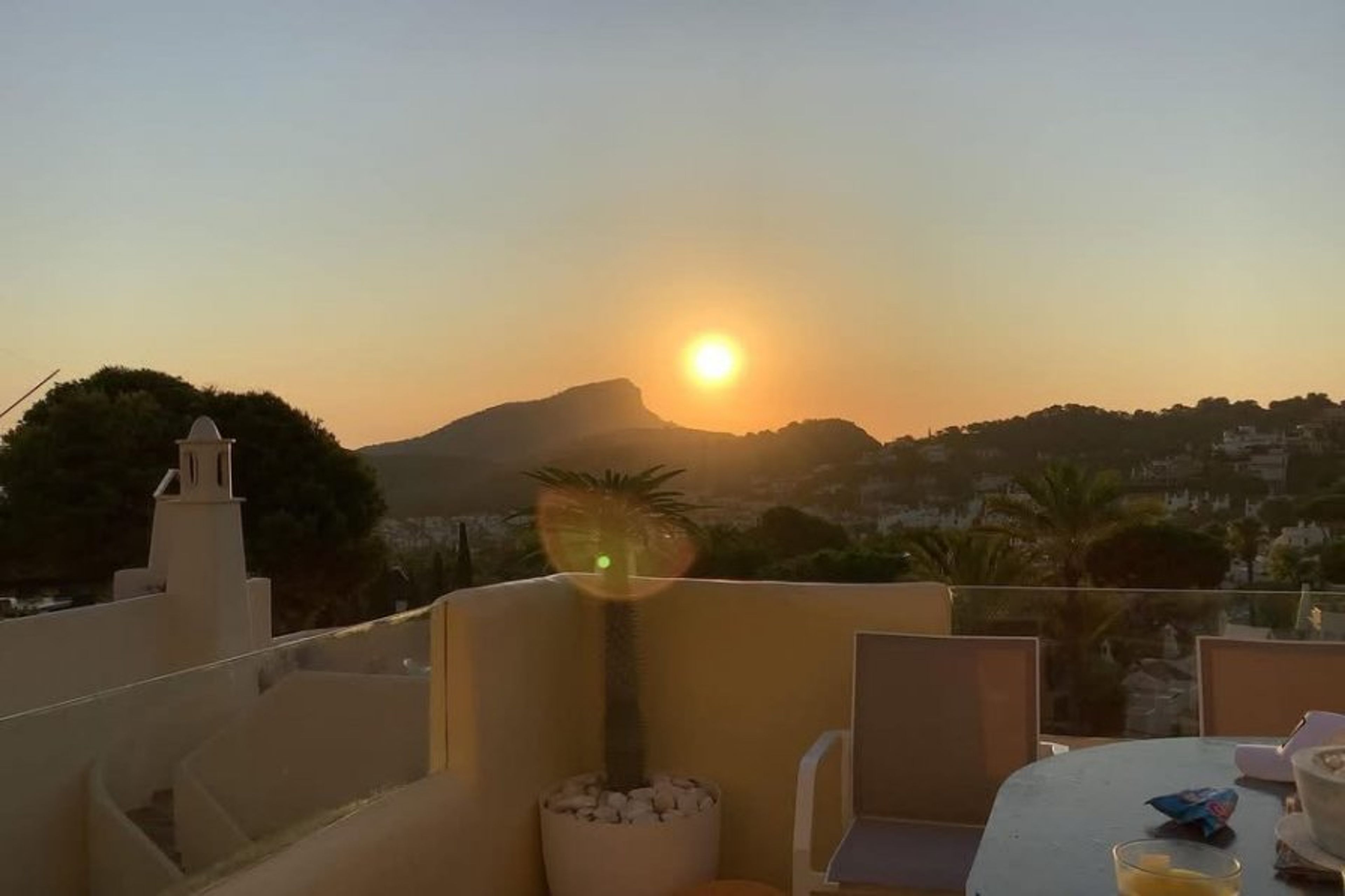 Sun rise from the living room terrace with new glass.