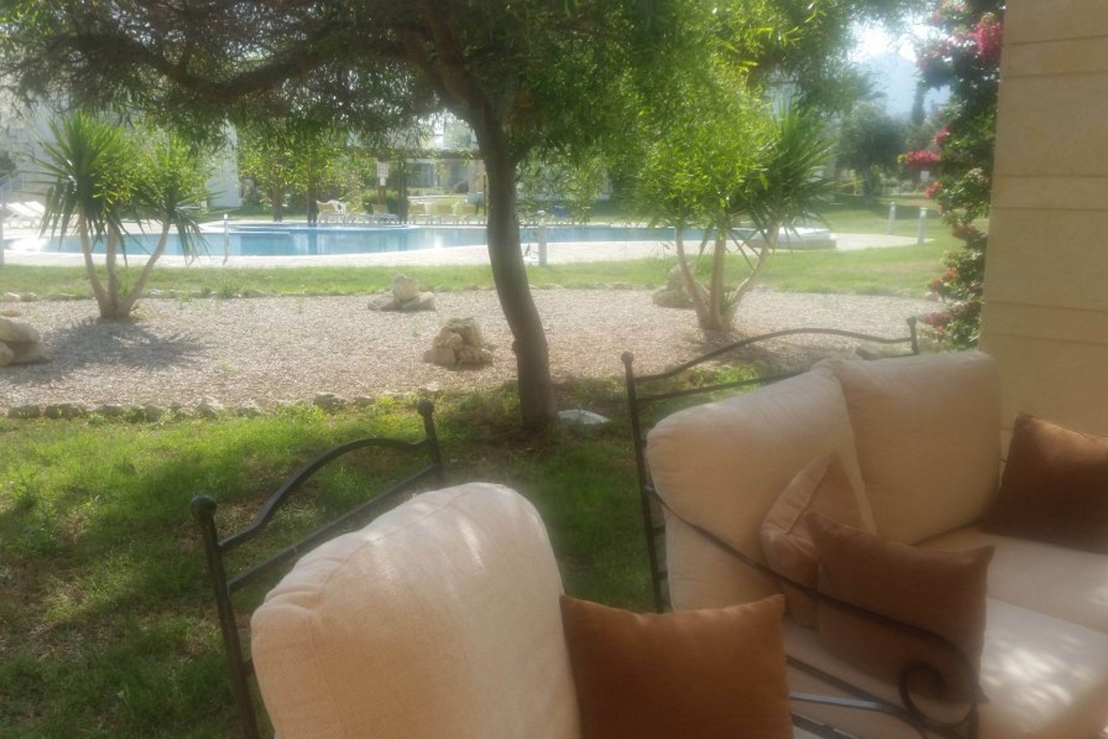 Patio aspects to the pool, one of 7 pools on the comple