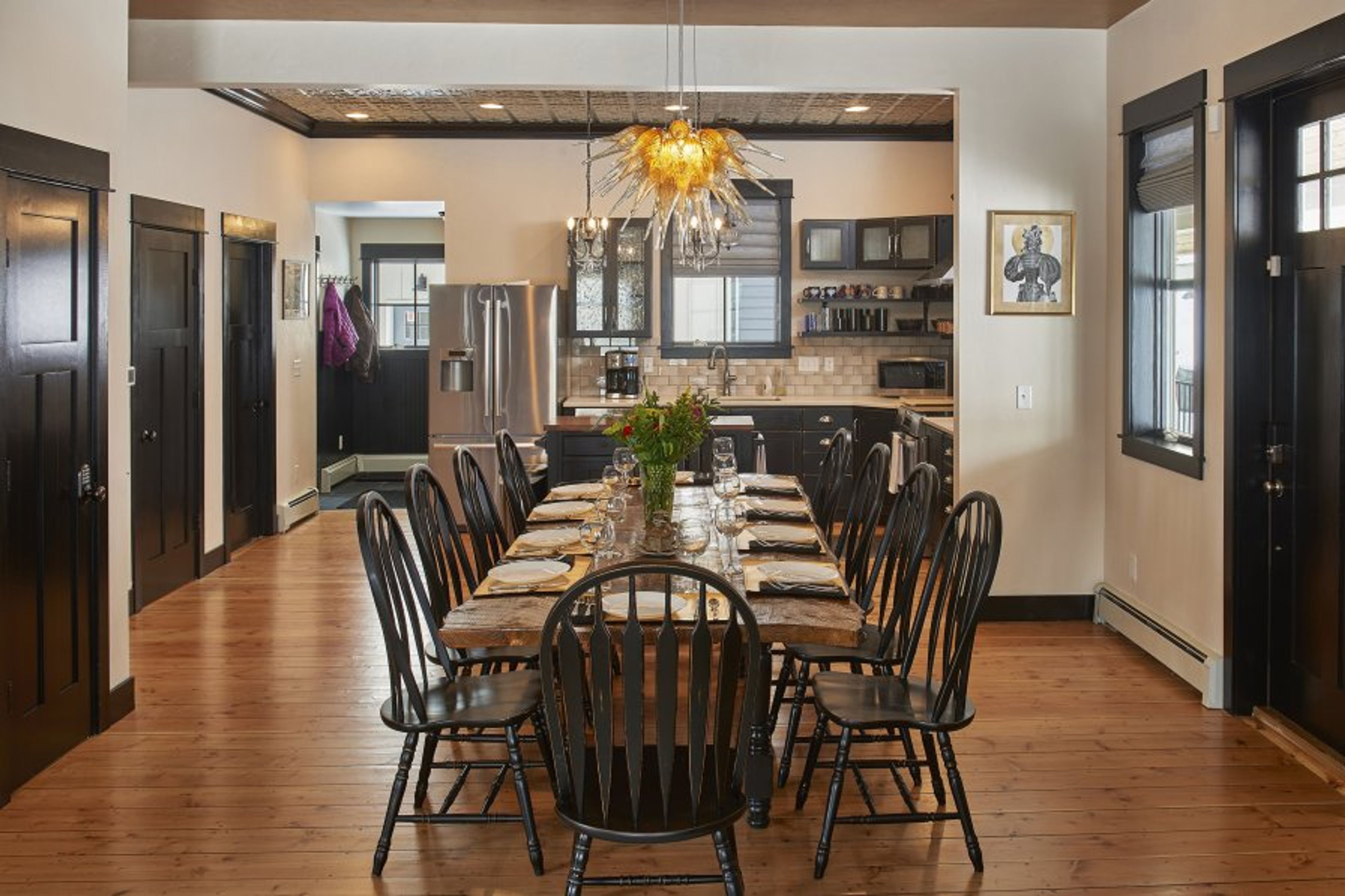The hand-made dining room table can seat ten guests and is extra wide.