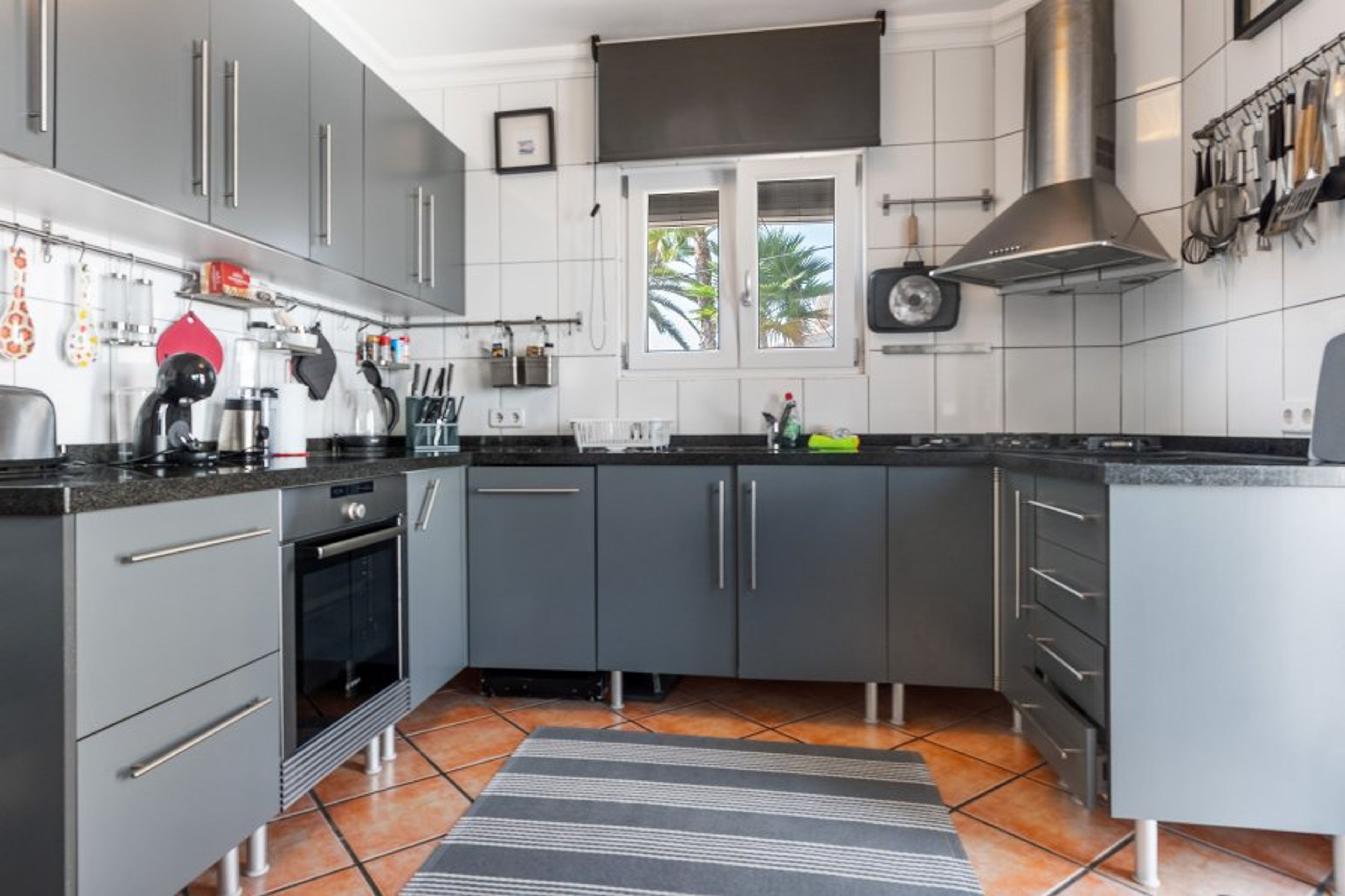 Complete kitchen with oven, fridge, dishwasher and coffee machines