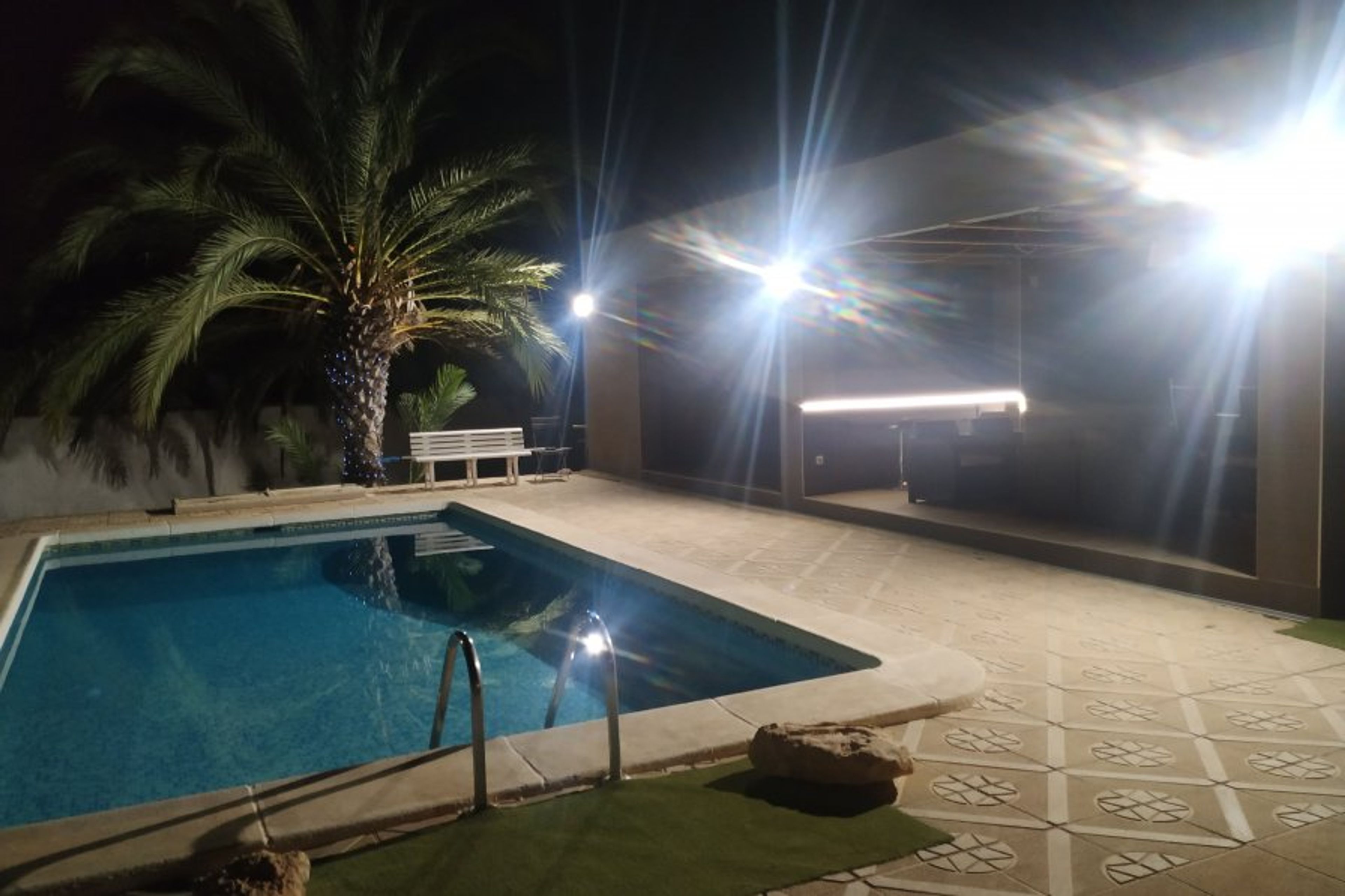 Pool and poolhouse at night