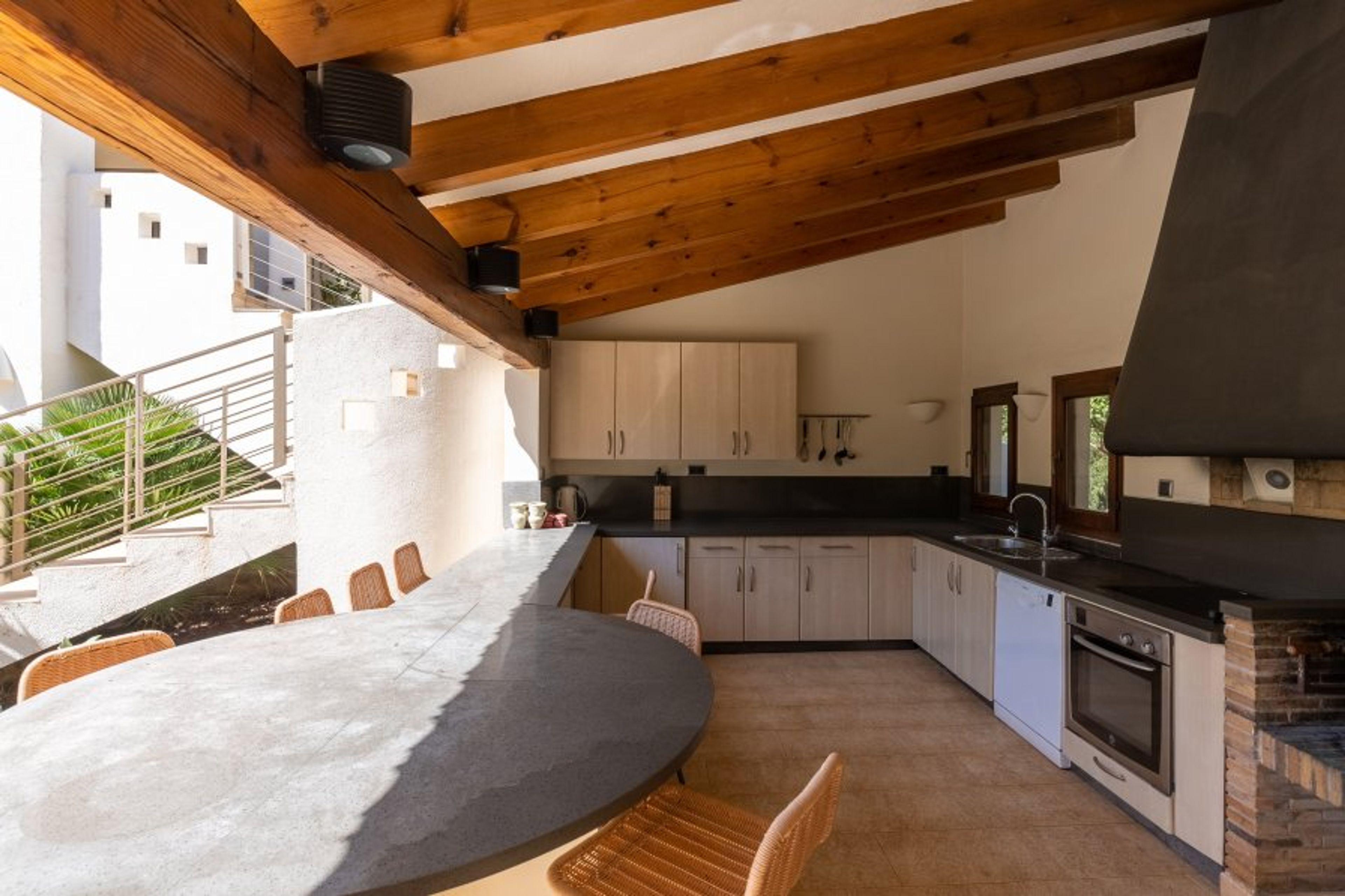 Outside kitchen next to the heated pool with bar