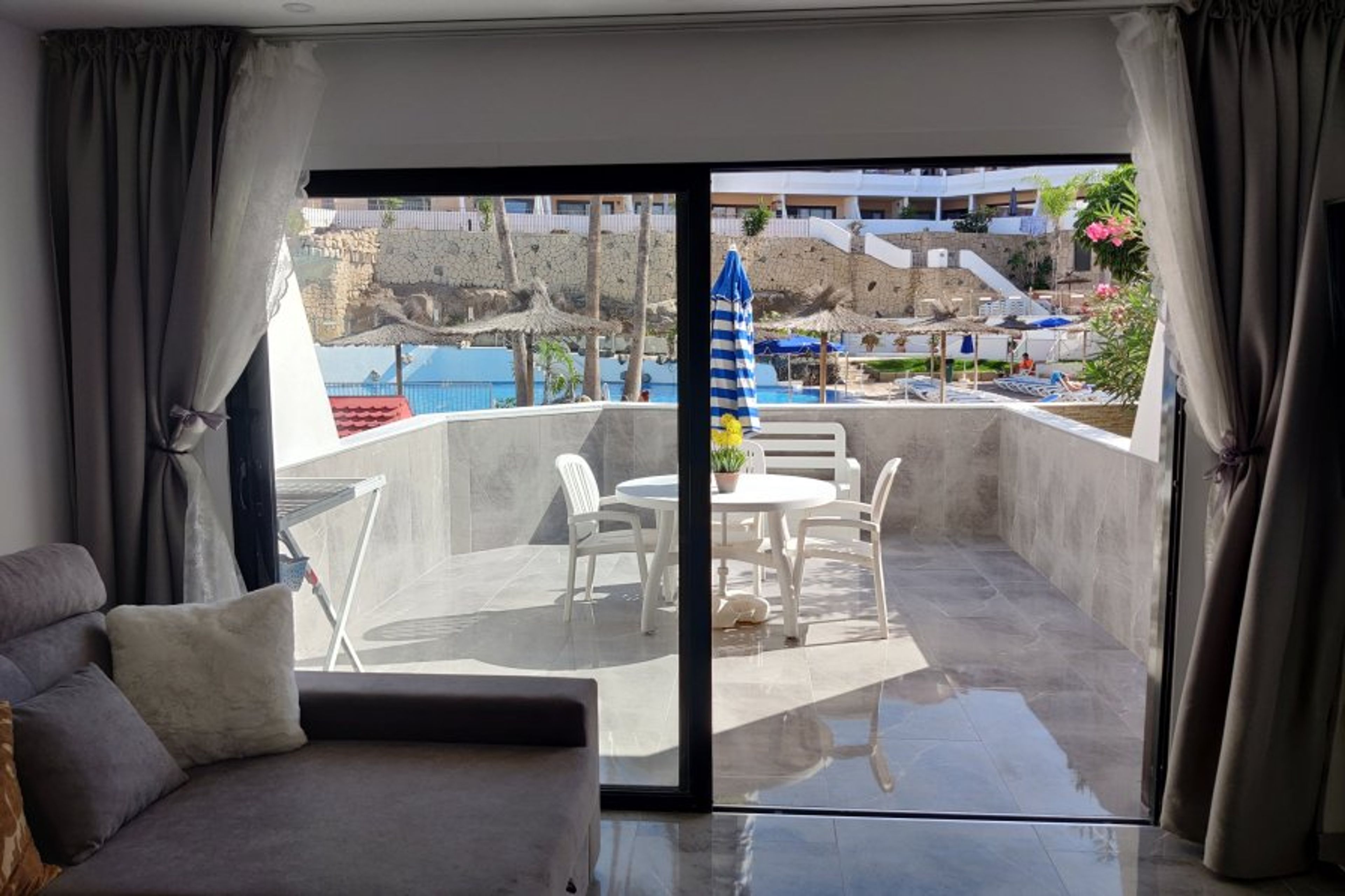 Living room loos out to pool area