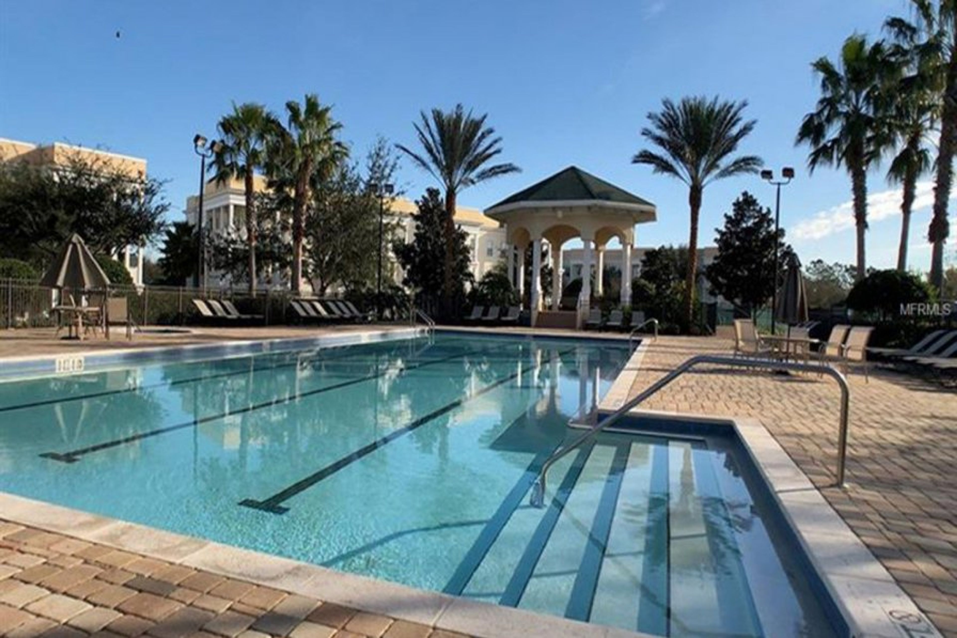 The Terraces Lap pool directly opposite the condo, jacuzzi, loungers
