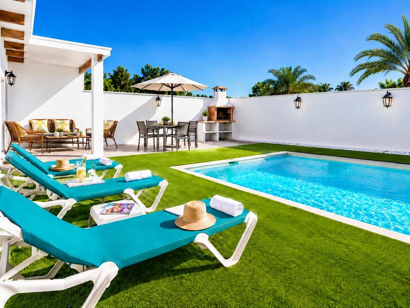 Villa in Spain, Nerja: Sunny private pool area with turquoise sun loungers, BBQ dining space, and ..