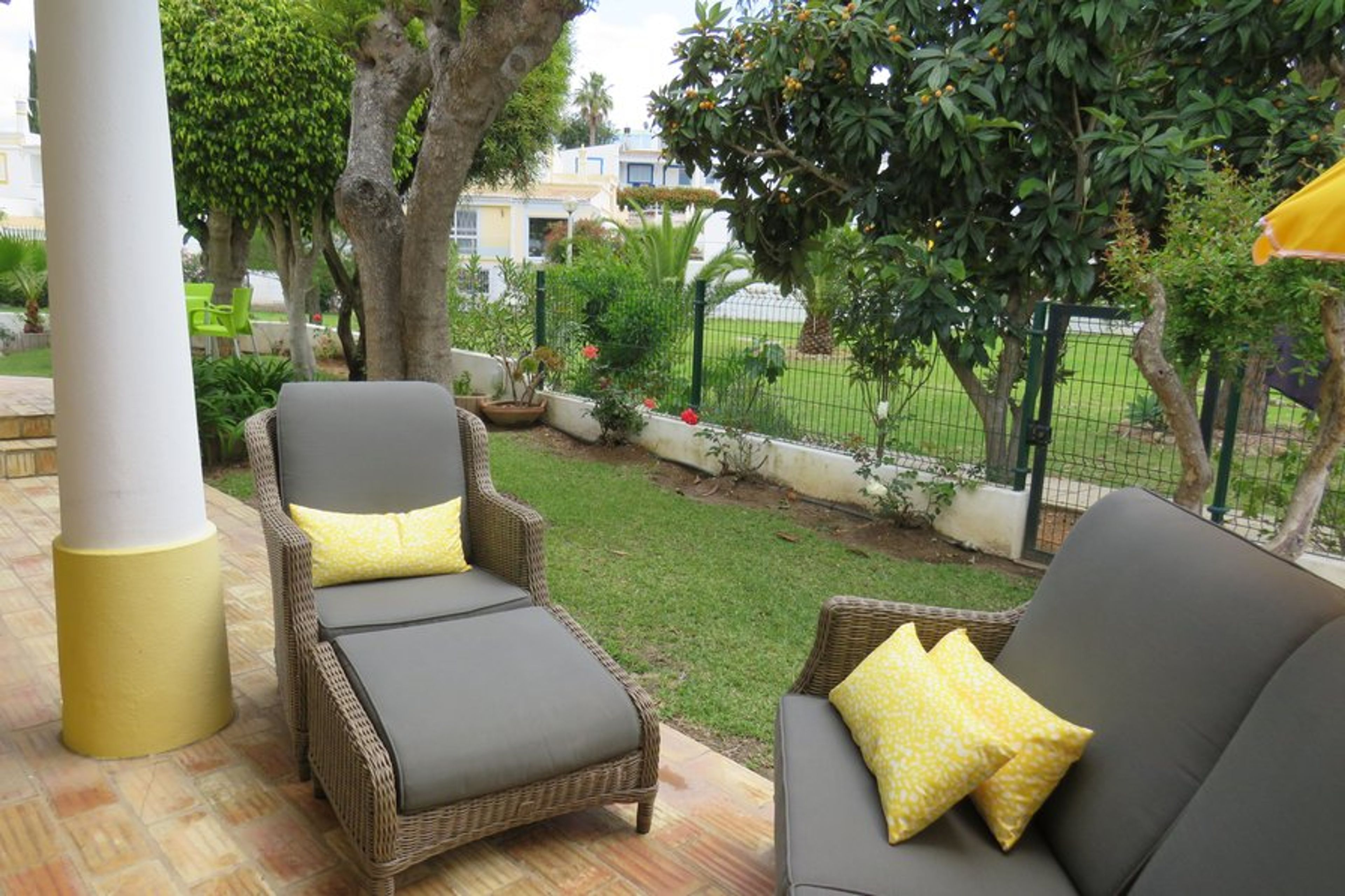 Chair, Footstool, Sofa Outdoor Lounge Set beside the pool and Nespara.