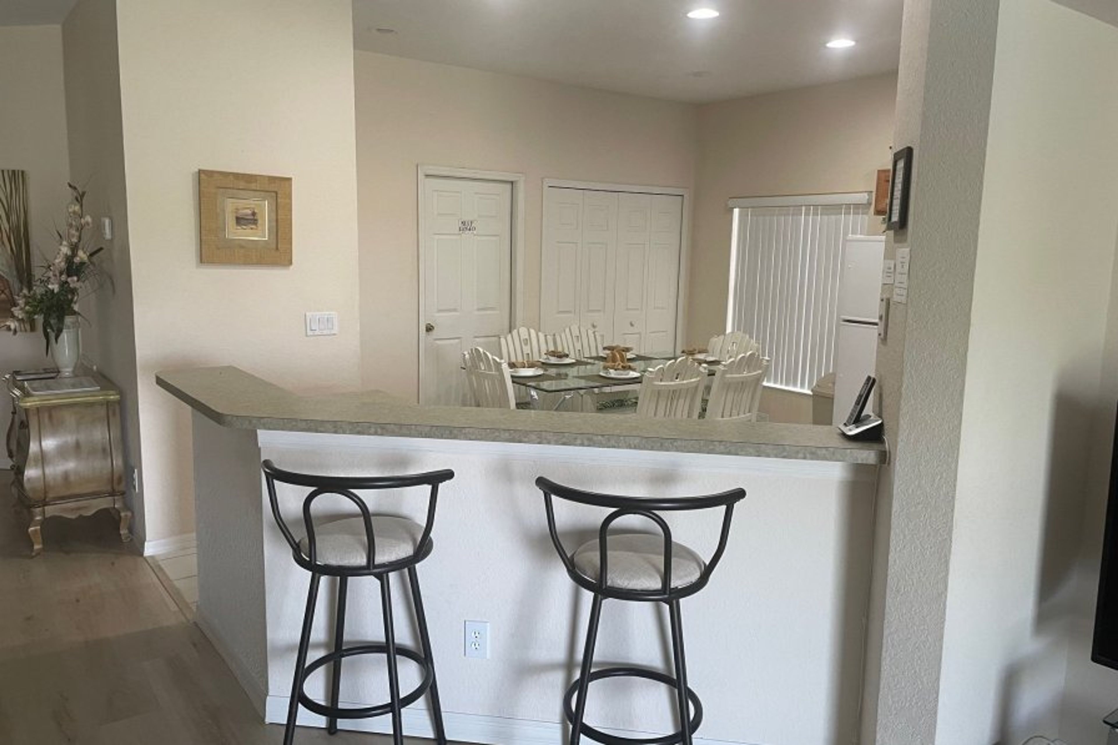 Dining table and large cupboard space with door to games room