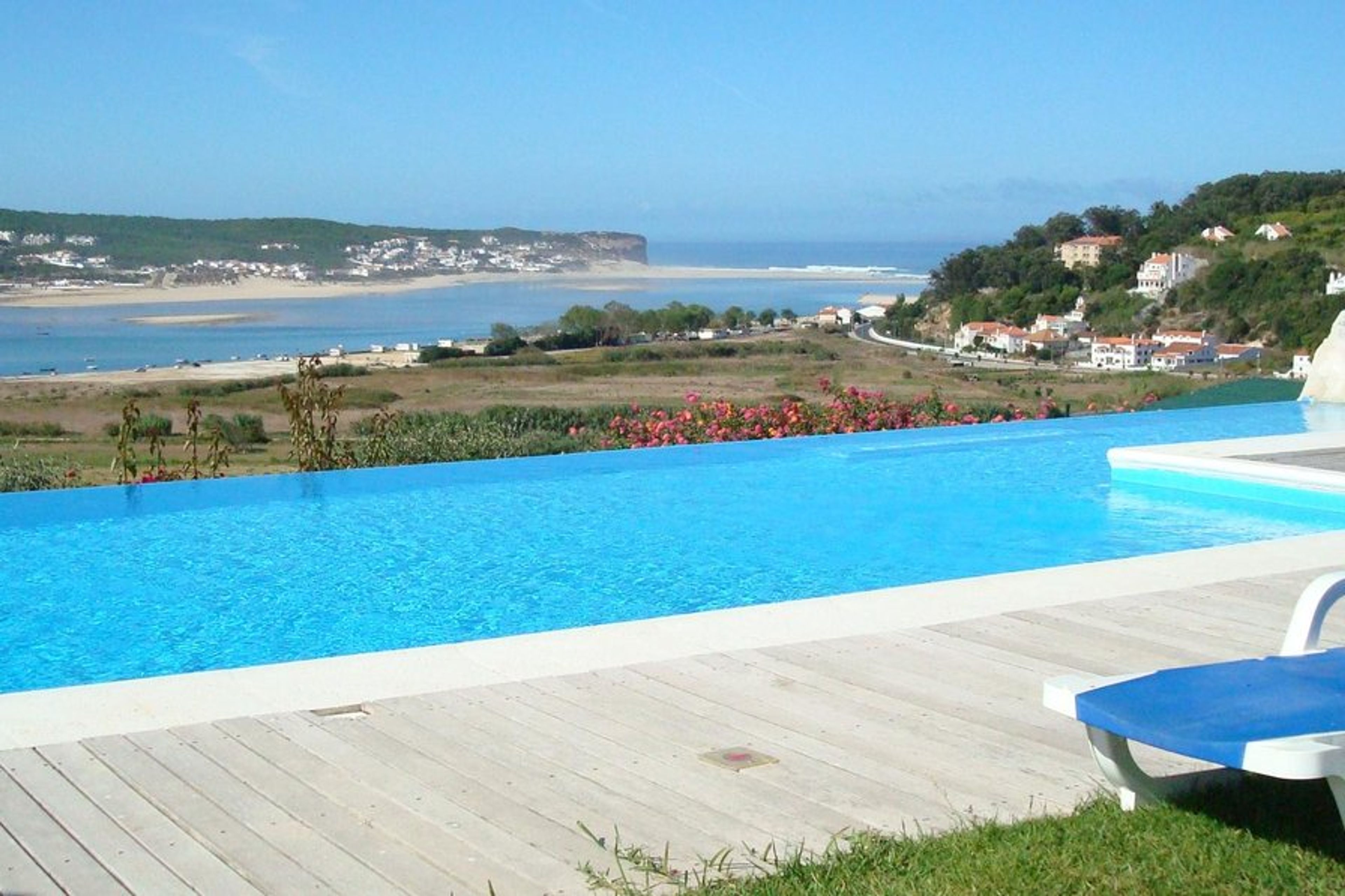 Panoramic heated pool with solid transparent fence and kids area
