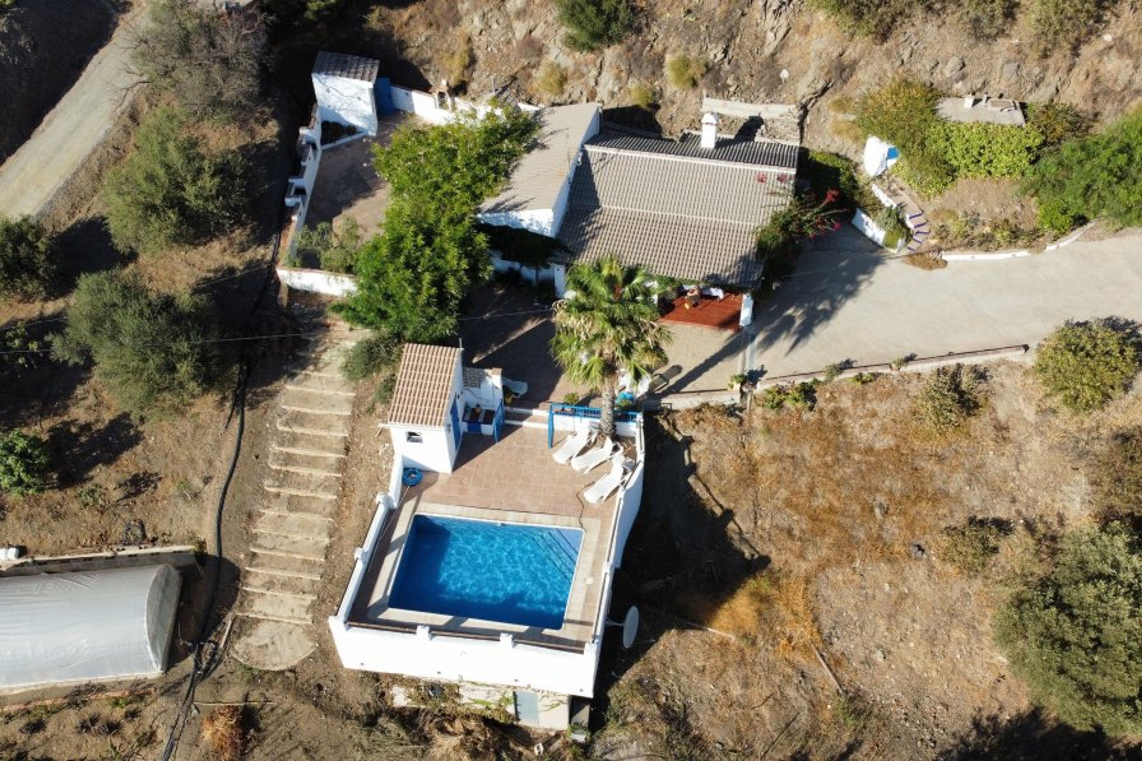 Drone footage of the house, edge of our border is the steps.