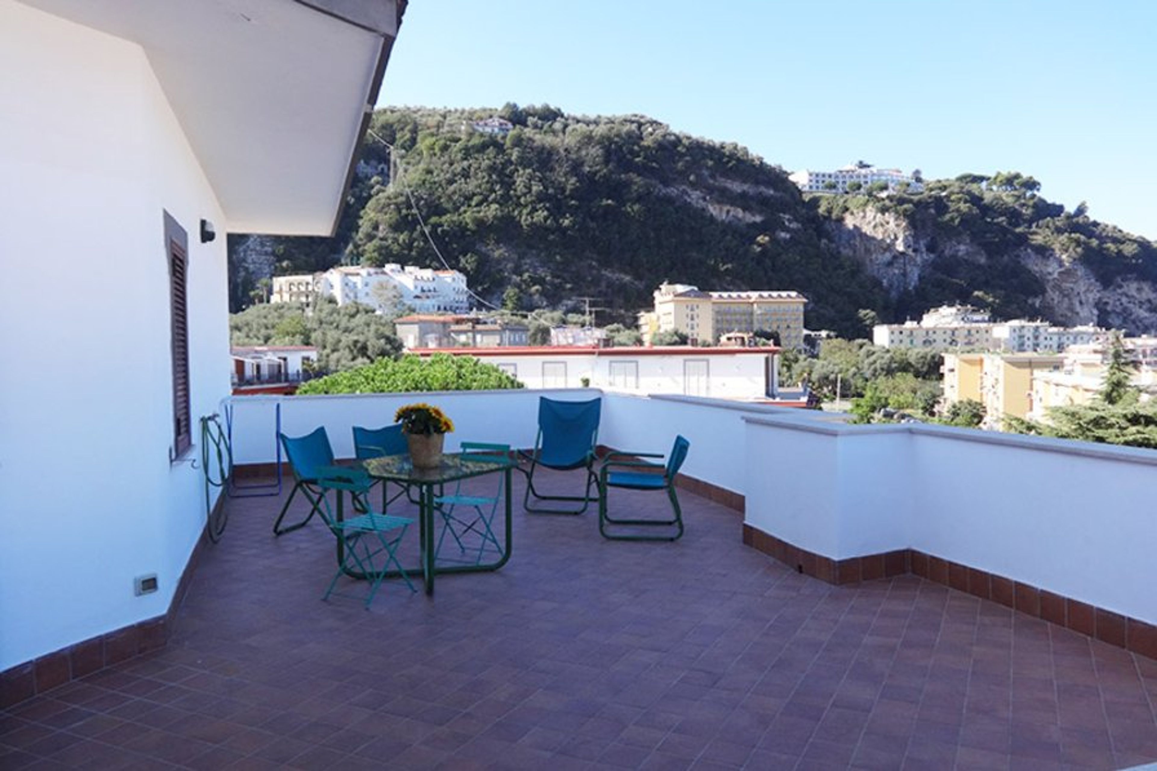 Large terrace with partial gulf of naples view and pool at casa begius