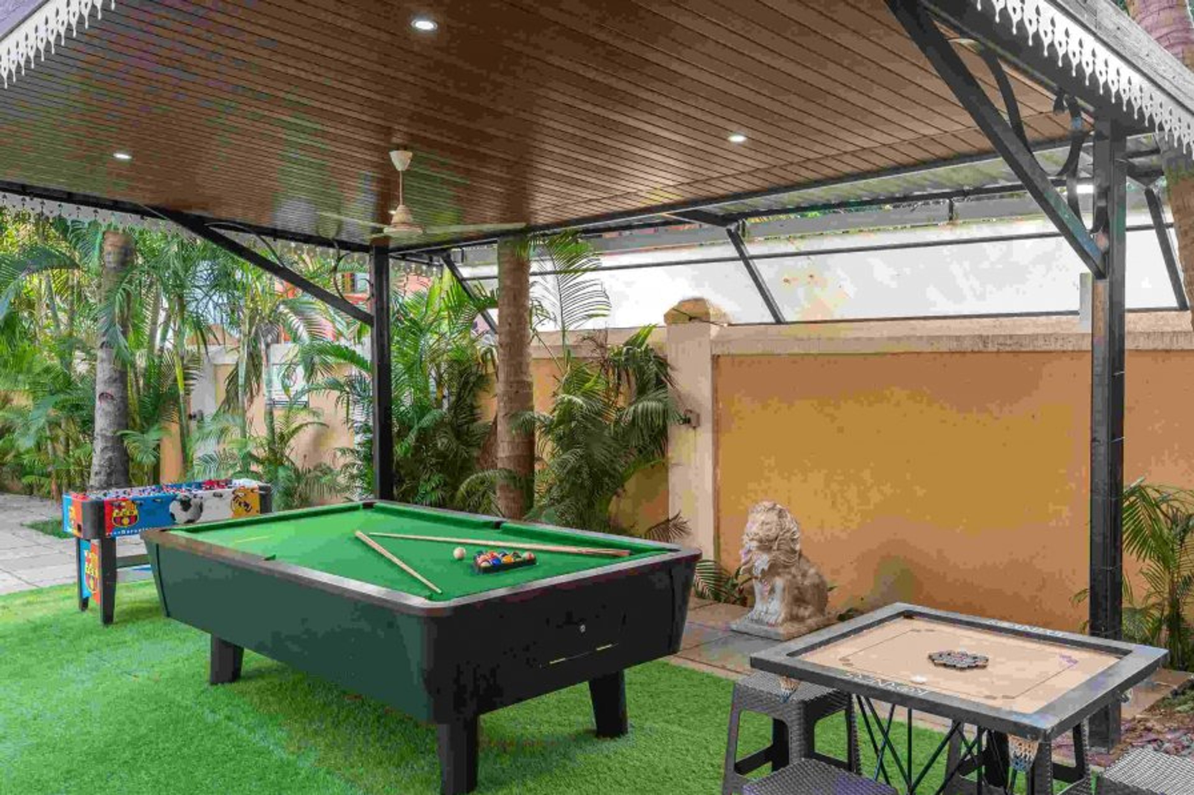 Play area with indoor games - foosball, carrom and pool table. 
