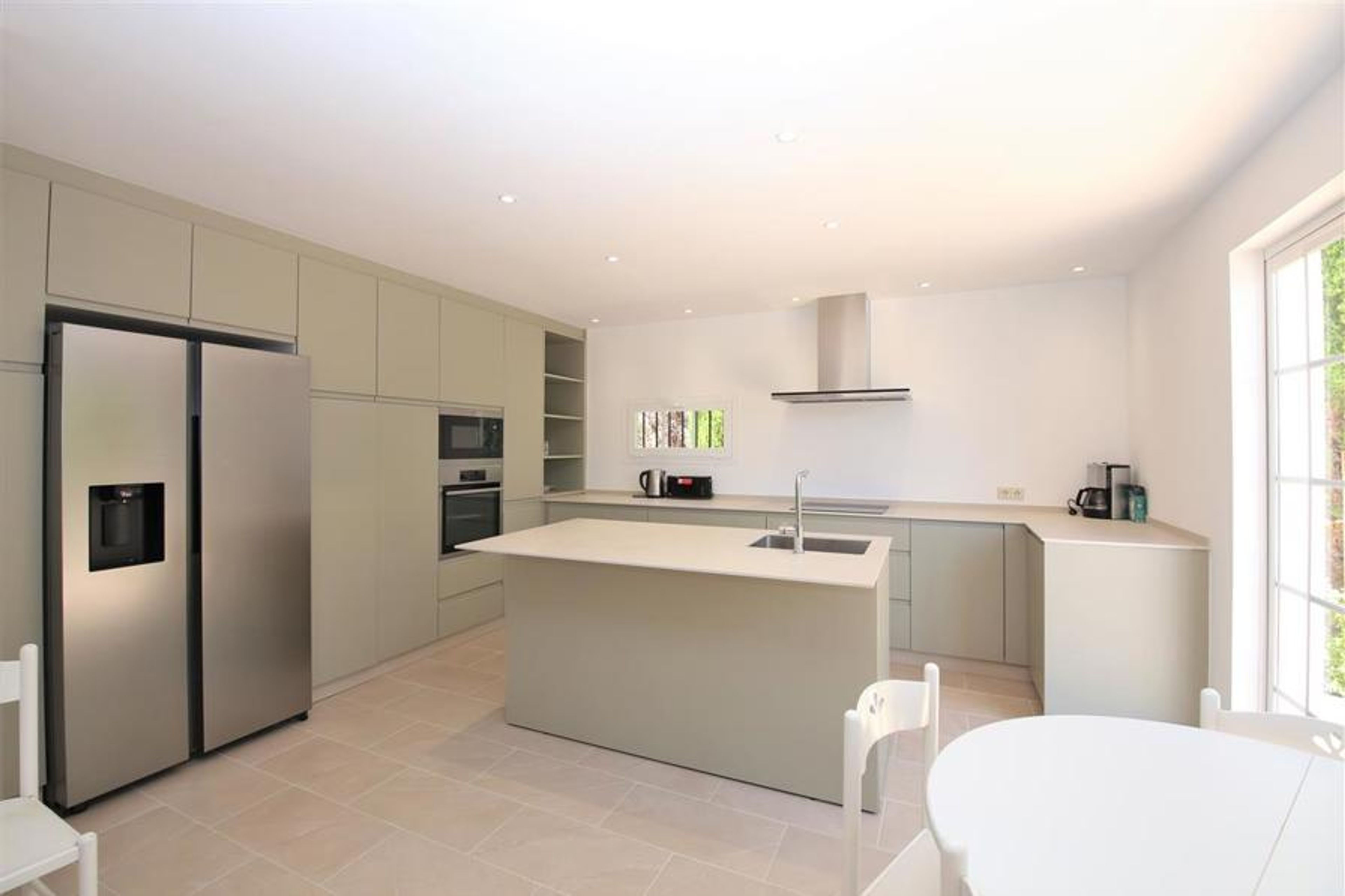 Modern and spacious kitchen is fully equipped with
