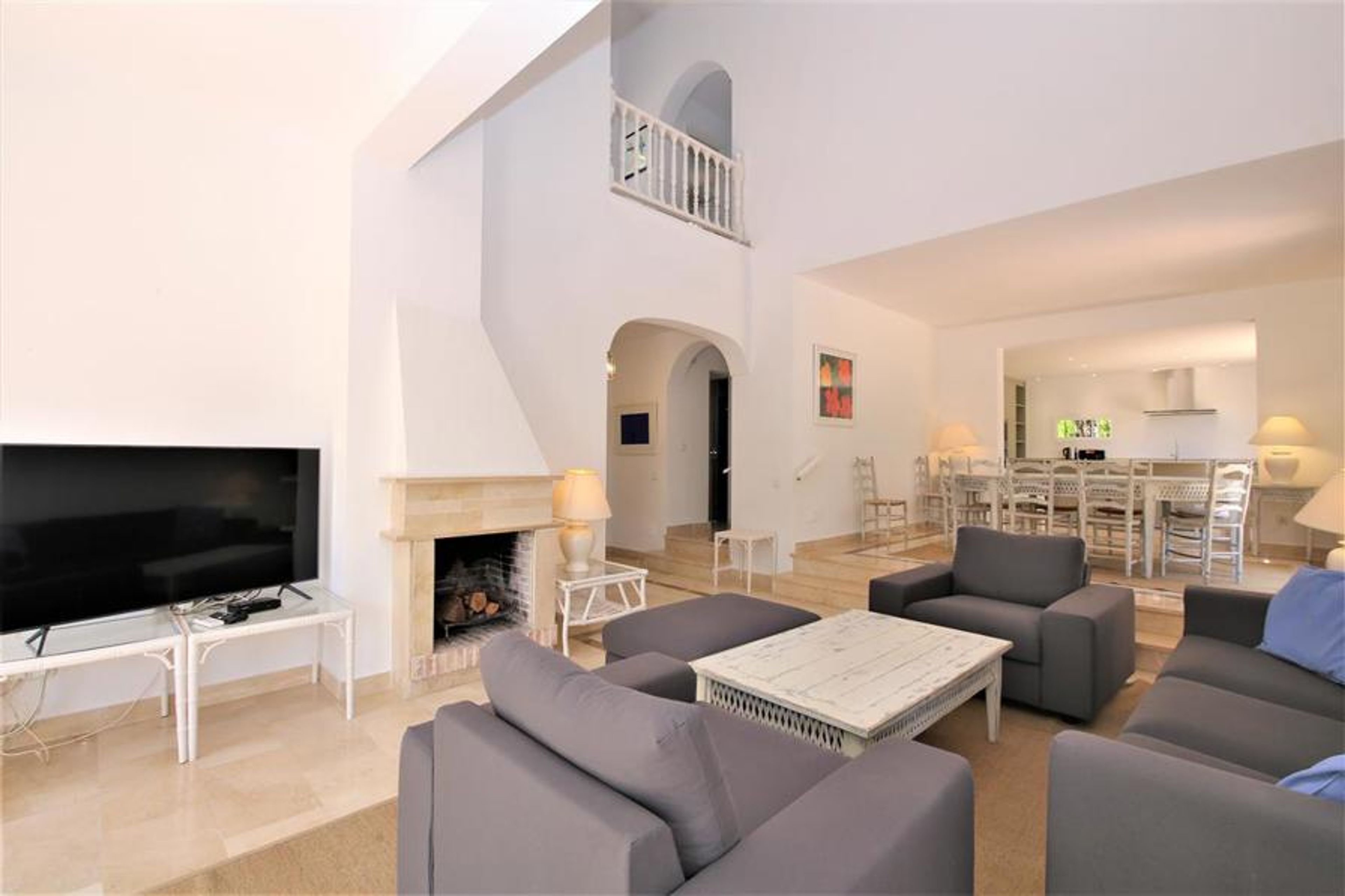 Another view of the lounge area with dining area t